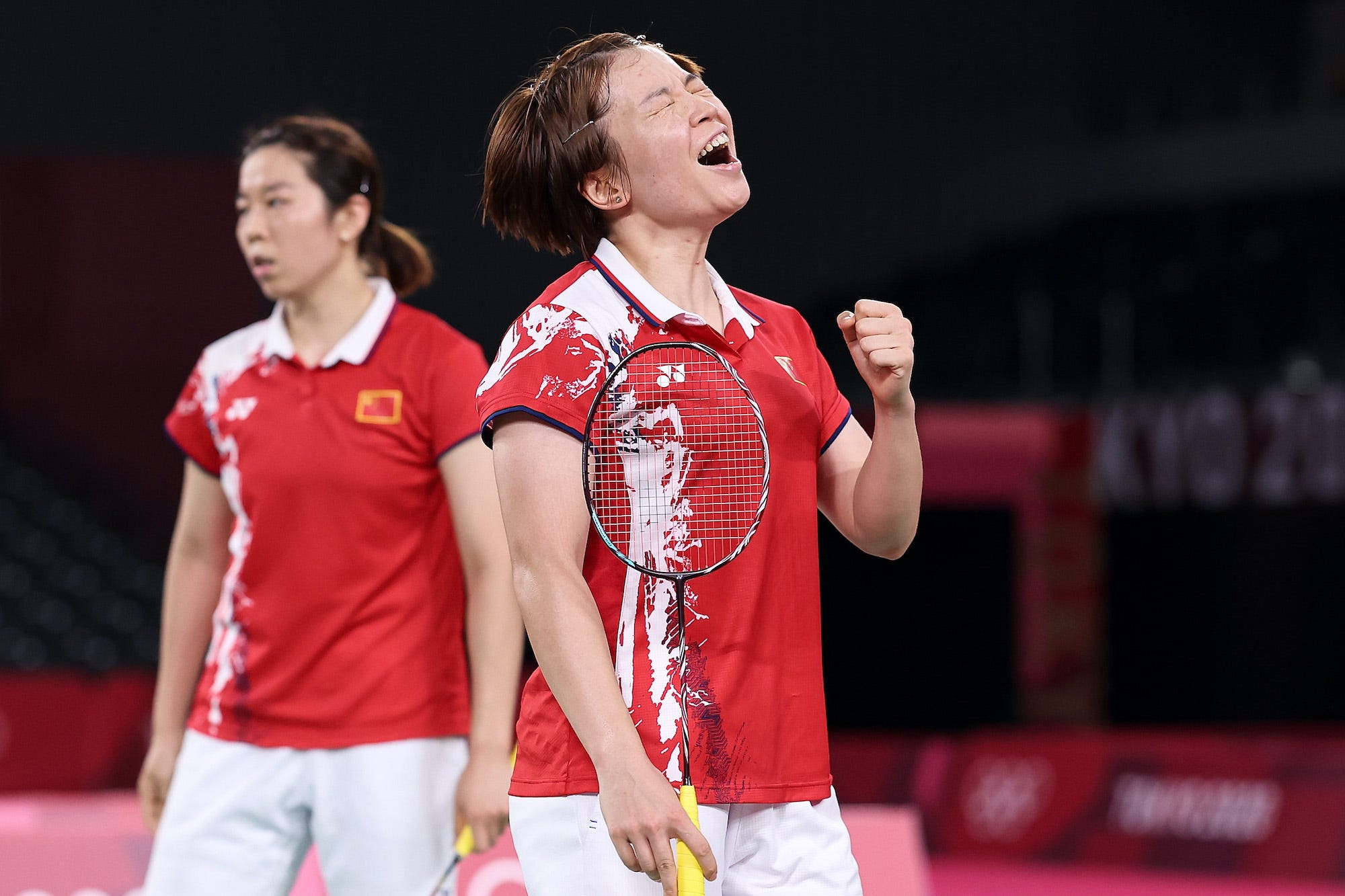 Chen Qing Chen reacts during a women's doubles match at the Olympic Games.