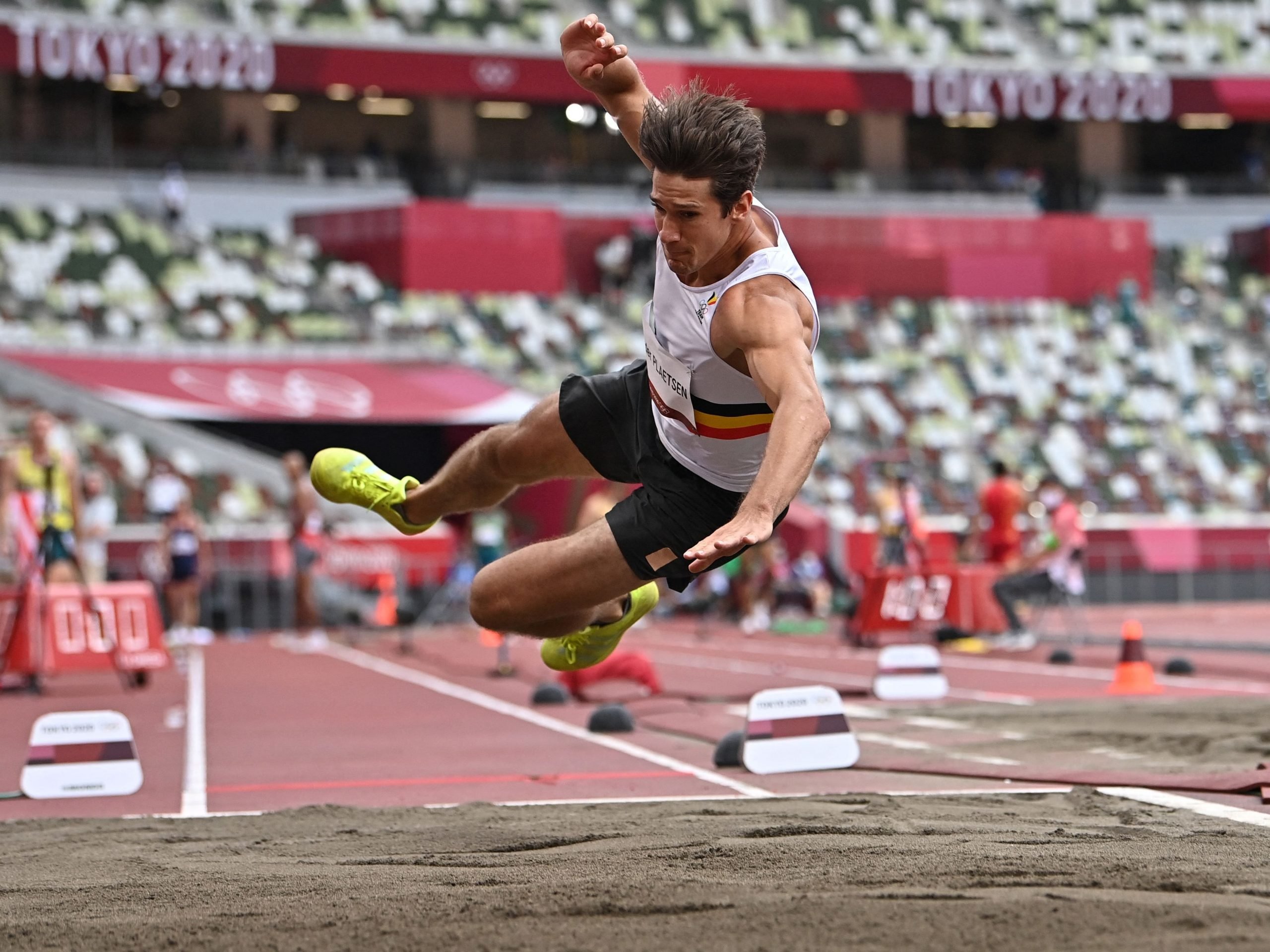 Belgium's Thomas Van Der Plaetsen injures himself while competing in the men's decathlon long jump during the Tokyo 2020 Olympic Games