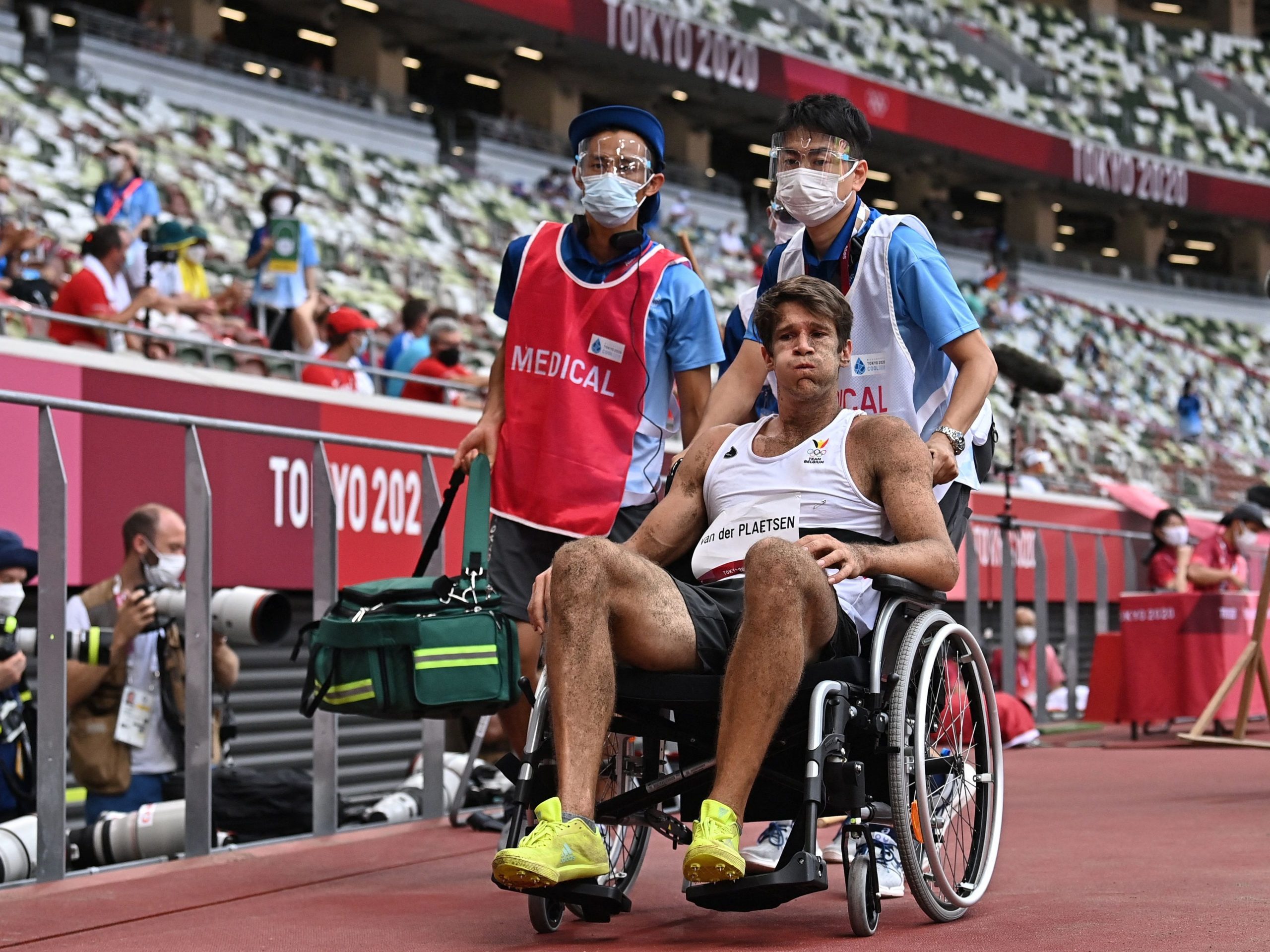 Thomas Van Der Plaetsen reacts as he leaves in a wheel chair after injuring himself while competing in the men's decathlon long jump during the Tokyo 2020 Olympic Games