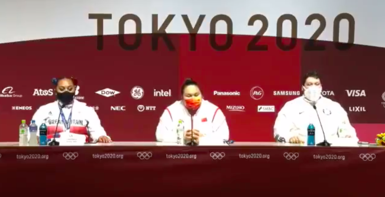 The women's weightlifting podium address the press at the Olympic Games in Tokyo.