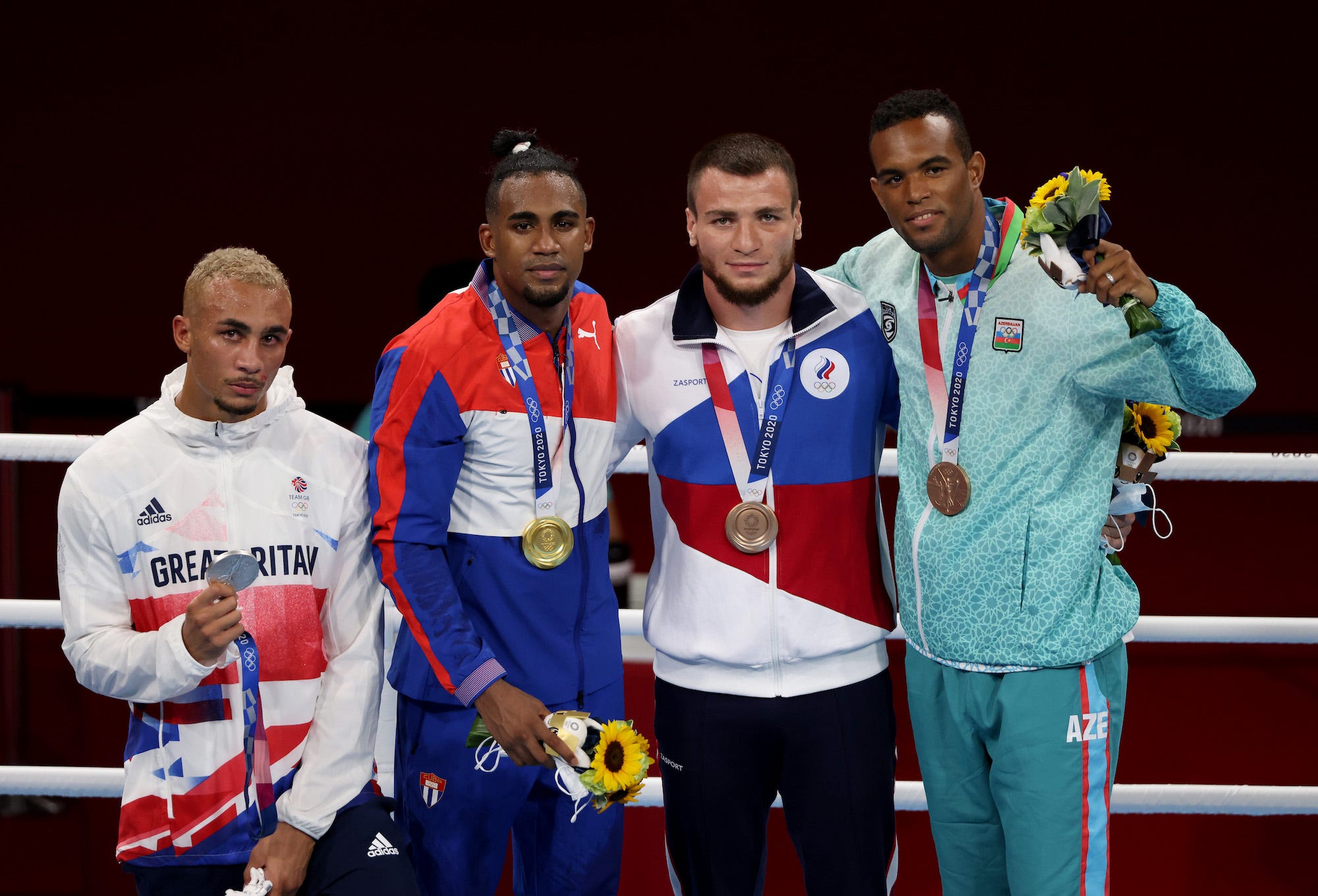 Men’s Light Heavy medalists Benjamin Whittaker of Team Great Britain, Arlen Lopez of Team Cuba, Imam Khataev of Team Russian Olympic Committee, and Loren Berto Alfonso Dominguez of Team Azerbaijan pose for photographs during the Victory Ceremony on day twelve of the Tokyo 2020 Olympic Games at Kokugikan Arena