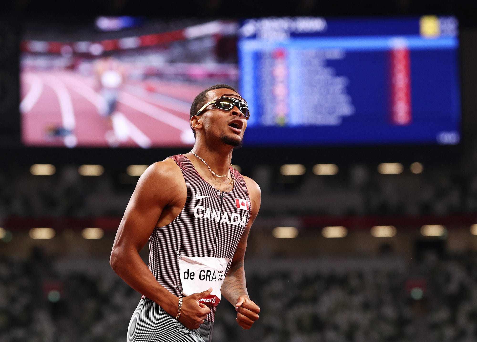 Andre de Grasse of Team Canada celebrates after winning the gold medal in the Men's 200m Final on day twelve of the Tokyo 2020 Olympic Games at Olympic Stadium