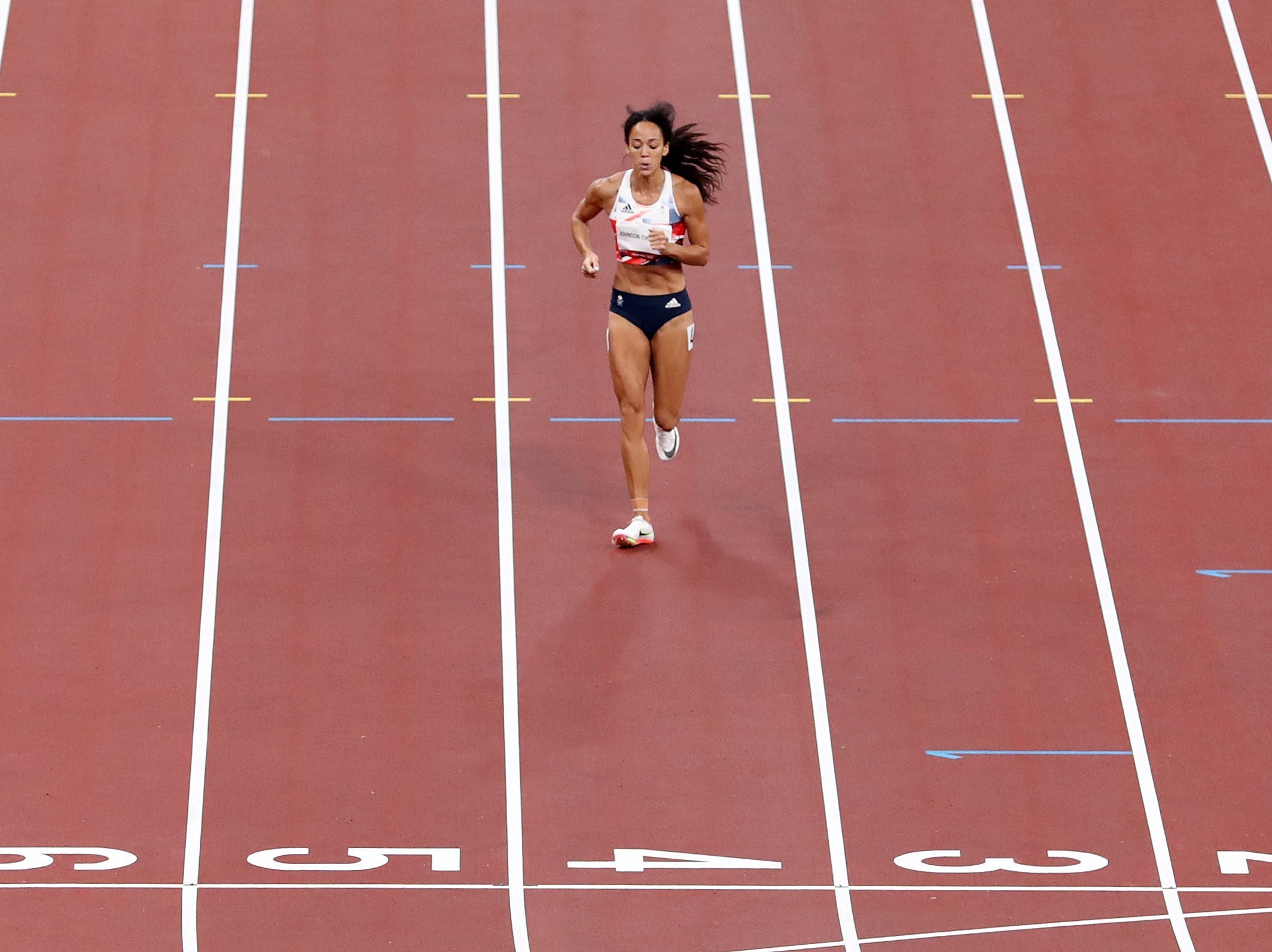 Katarina Johnson-Thompson of Team Great Britain limps across the finish line in the Women's Heptathlon 200 meter