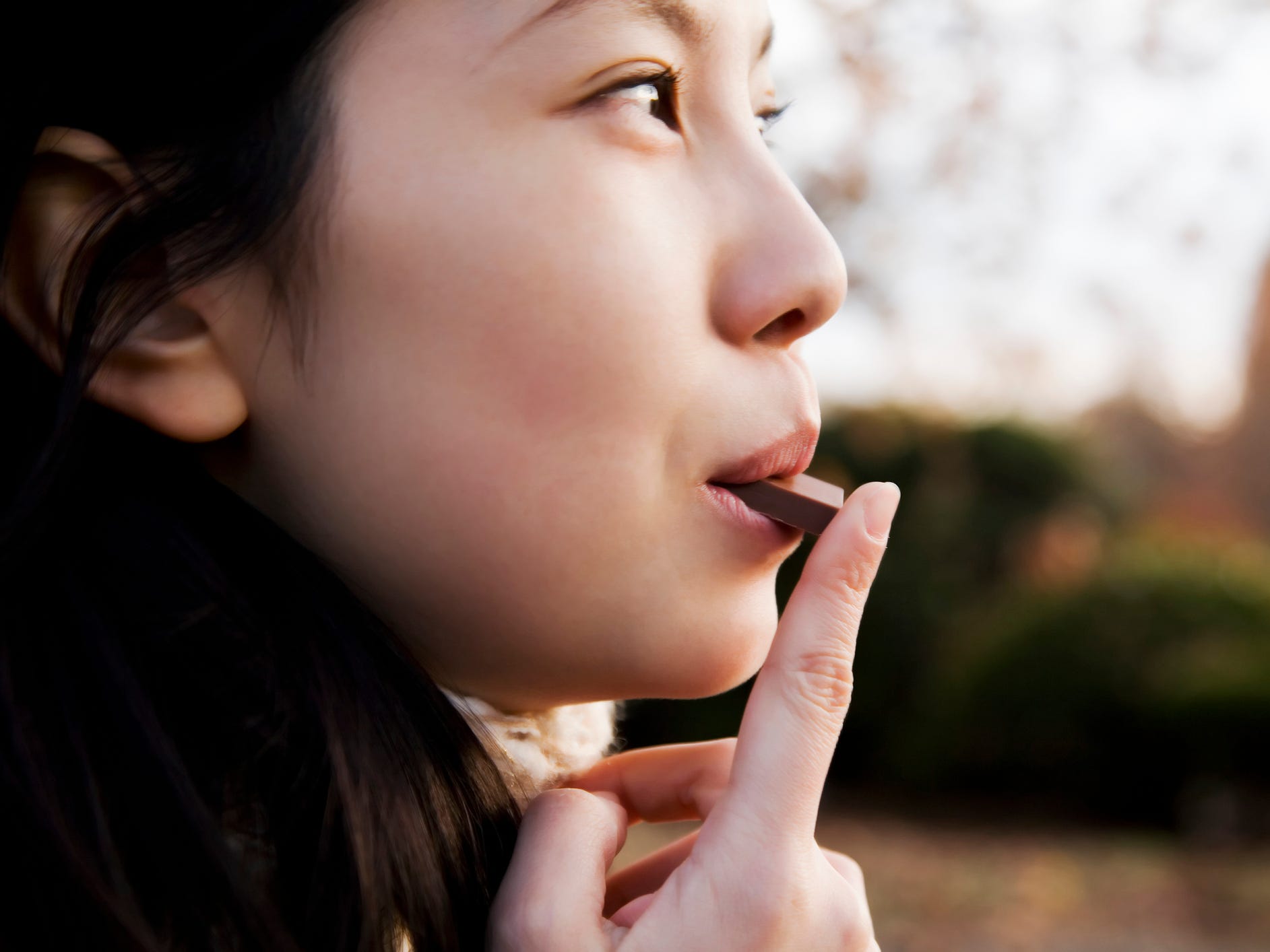 a woman eating chocolate