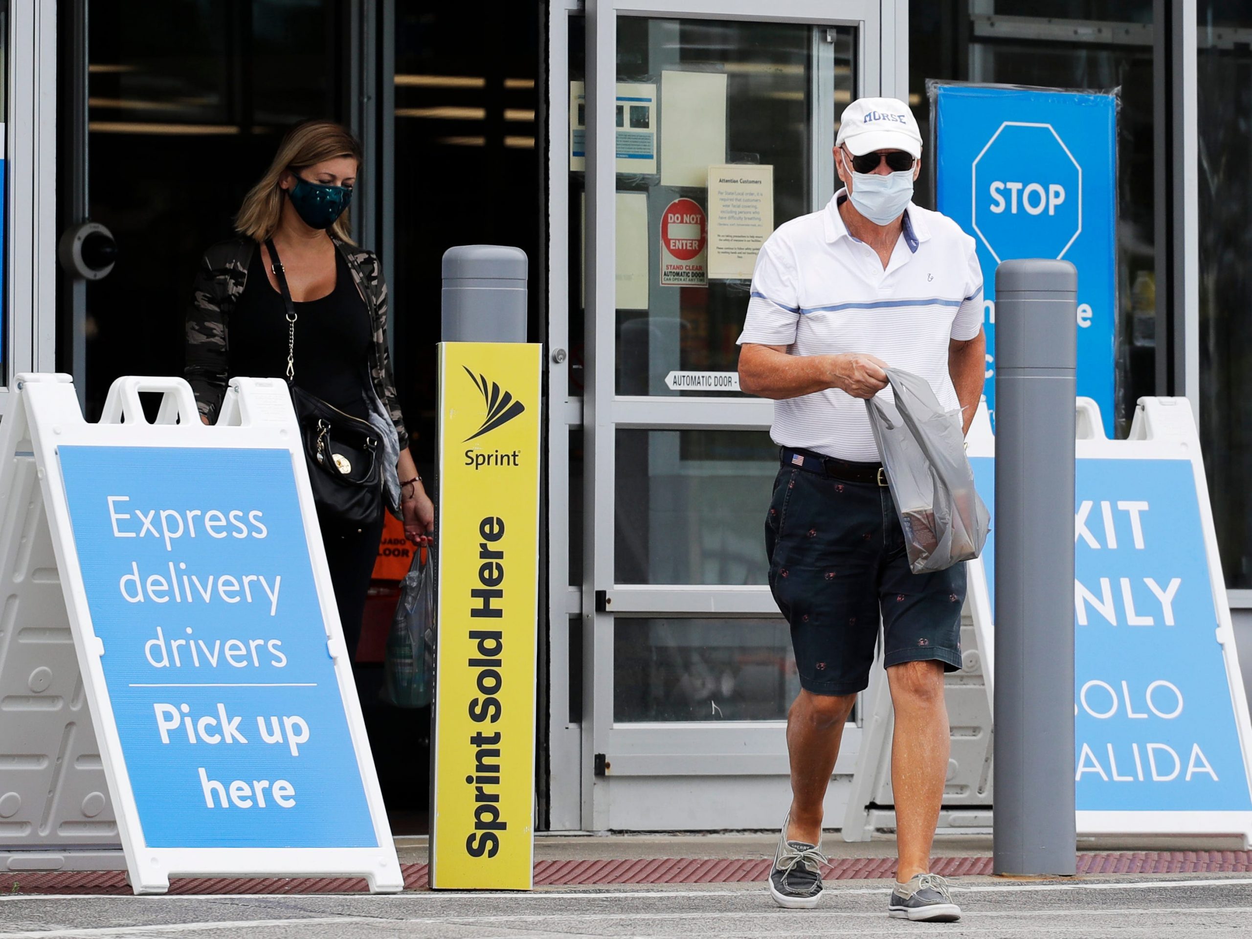 walmart shoppers leave store wearing face masks