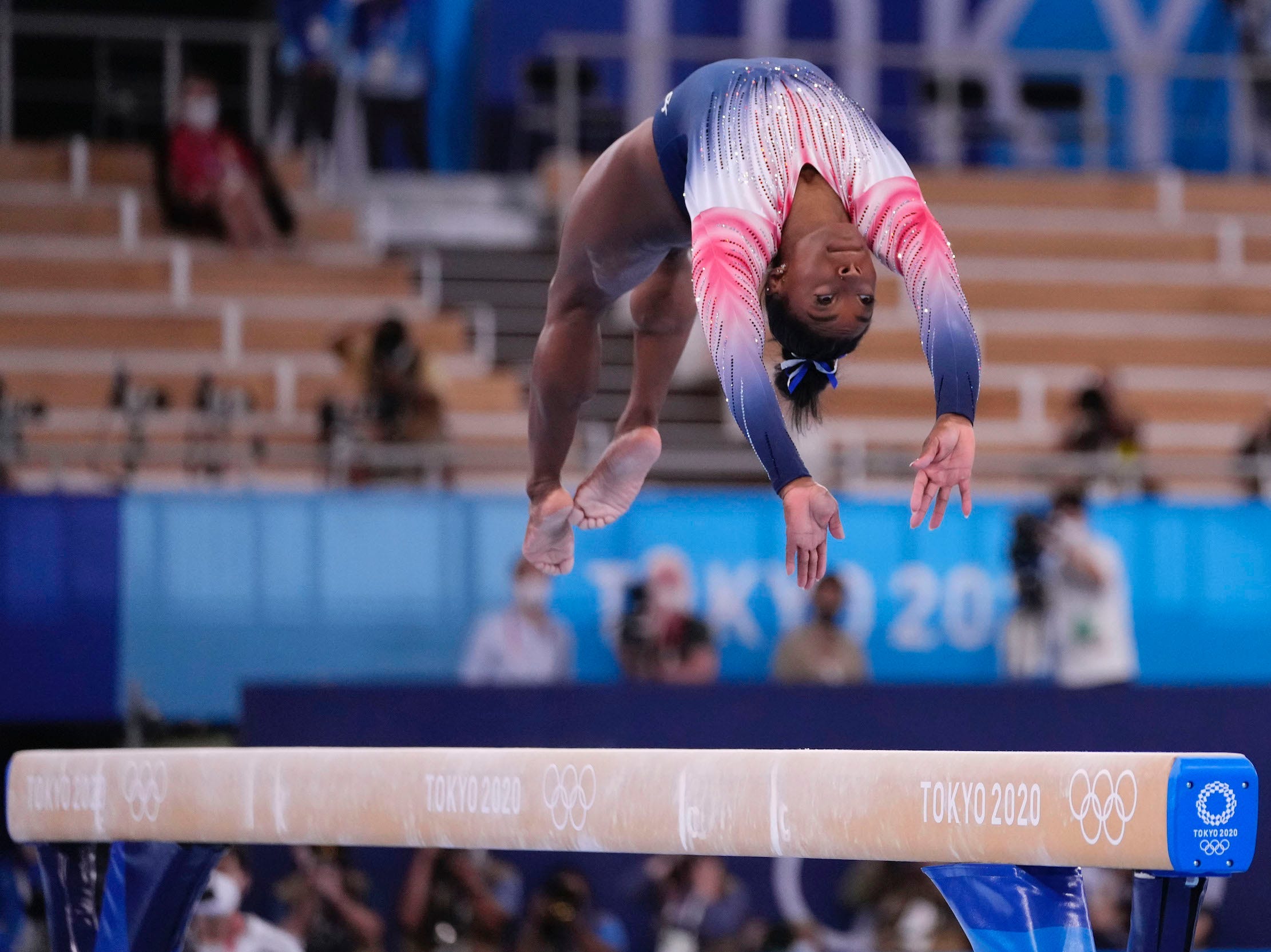 Simone Biles performs on the balance beam.
