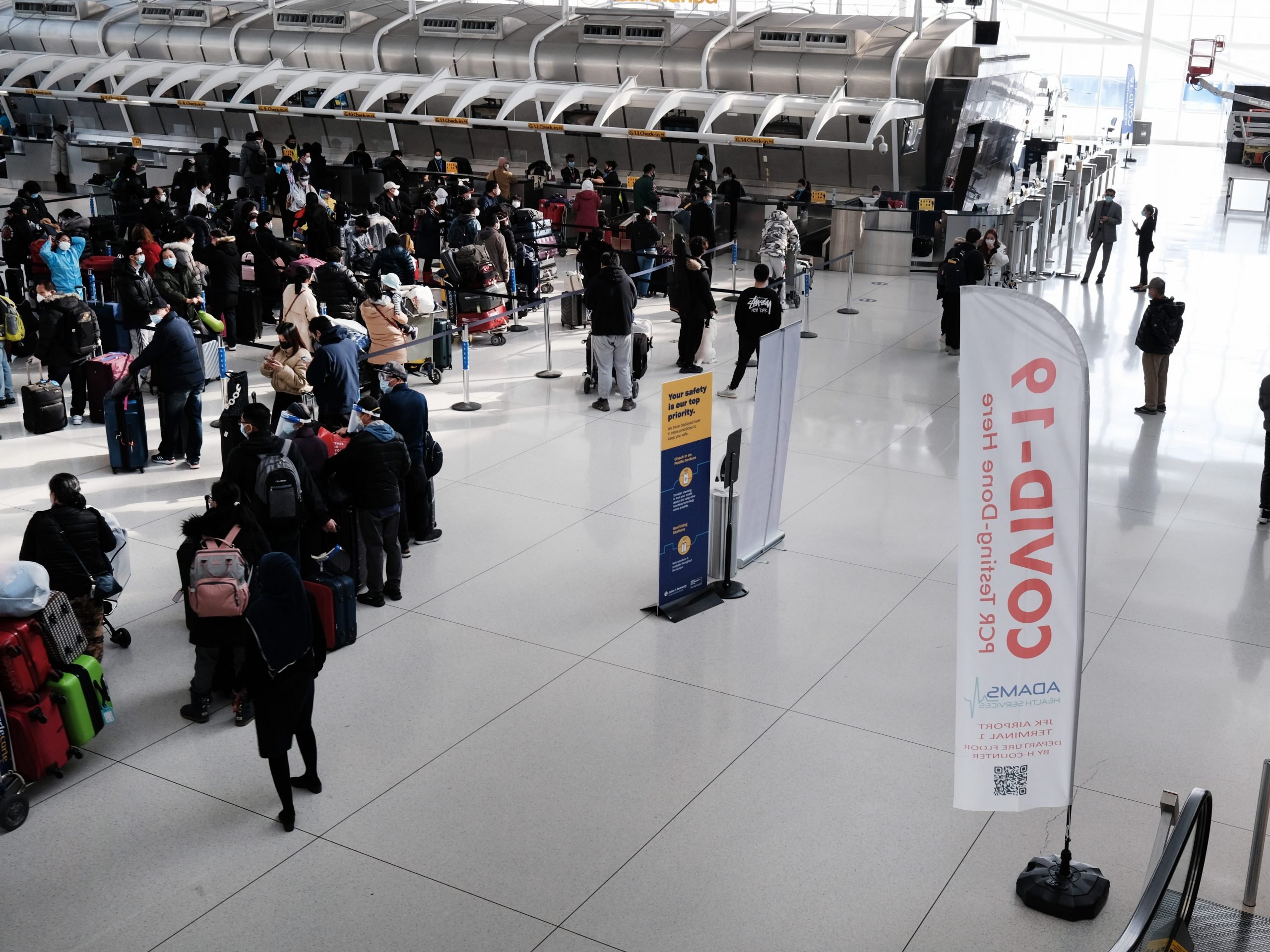 People wait for a flight at an international terminal at John F. Kennedy Airport (JFK) on January 25, 2021 in New York City.