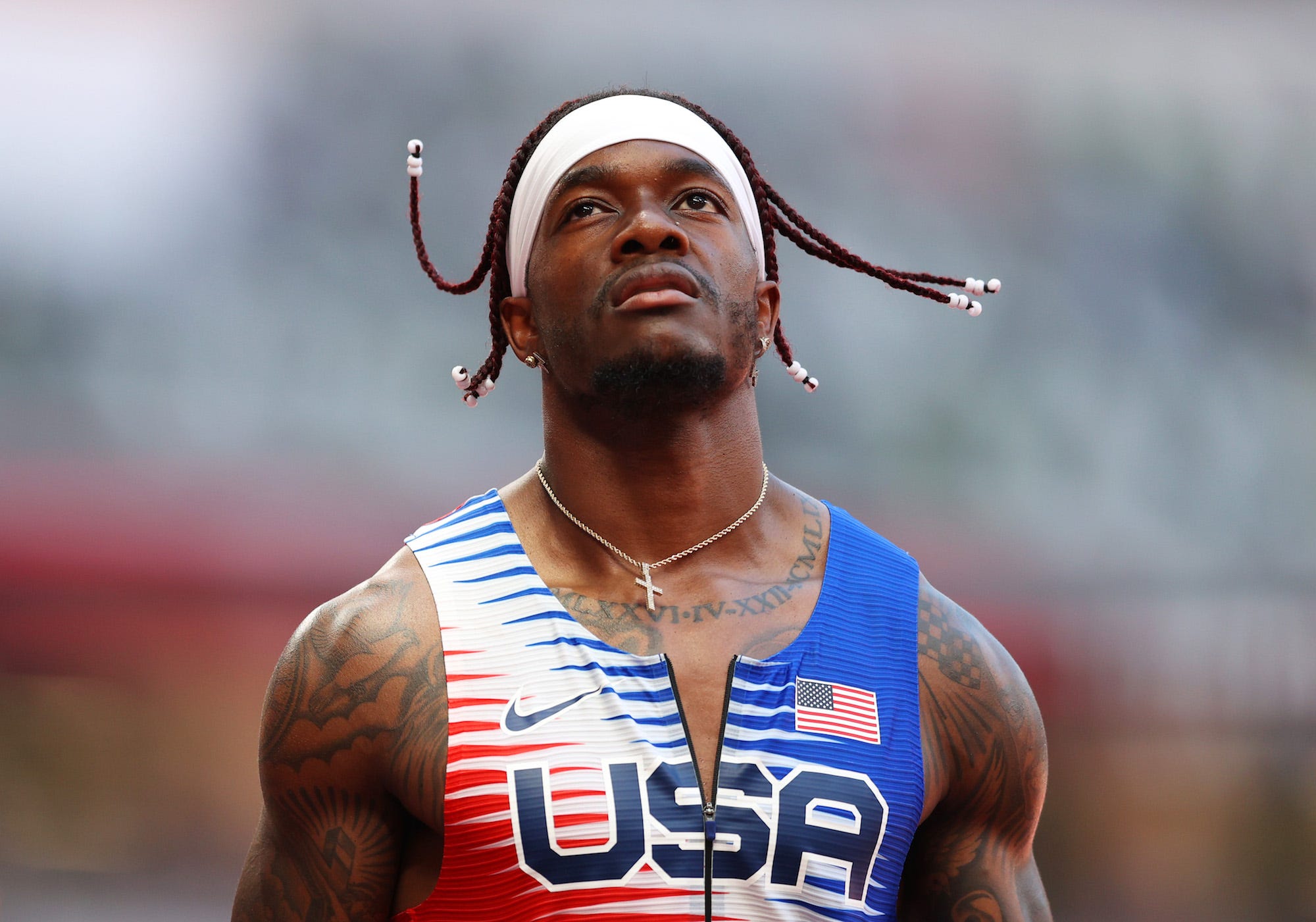 Cravon Gillespie of Team United States reacts after coming in sixth in round one of the Men's 4 x 100m Relay Heat 2 on day thirteen of the Tokyo 2020 Olympic Games at Olympic Stadium