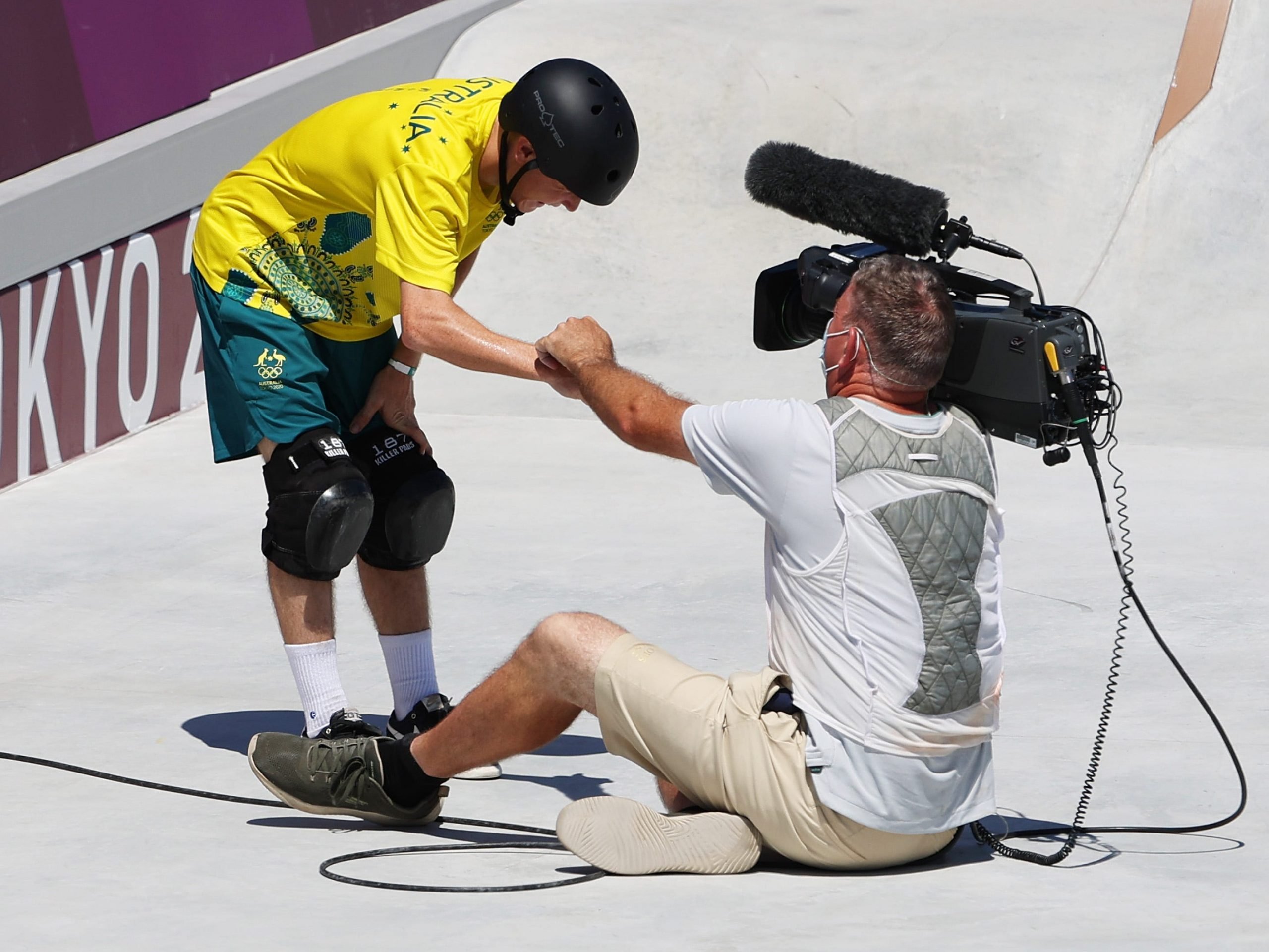 Kieran Woolley fistbumping a cameraman