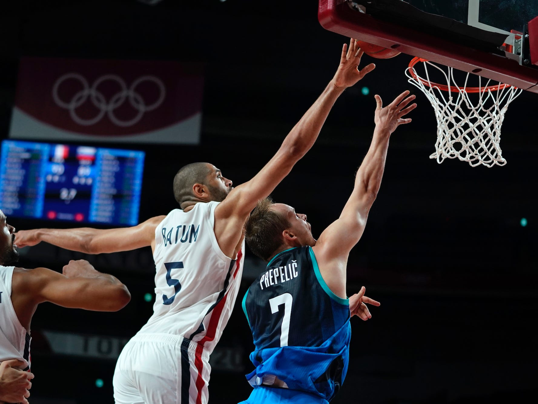 France's Nic Batum blocks Slovenia's Klemen Prepelic's shot at the Tokyo Olympics