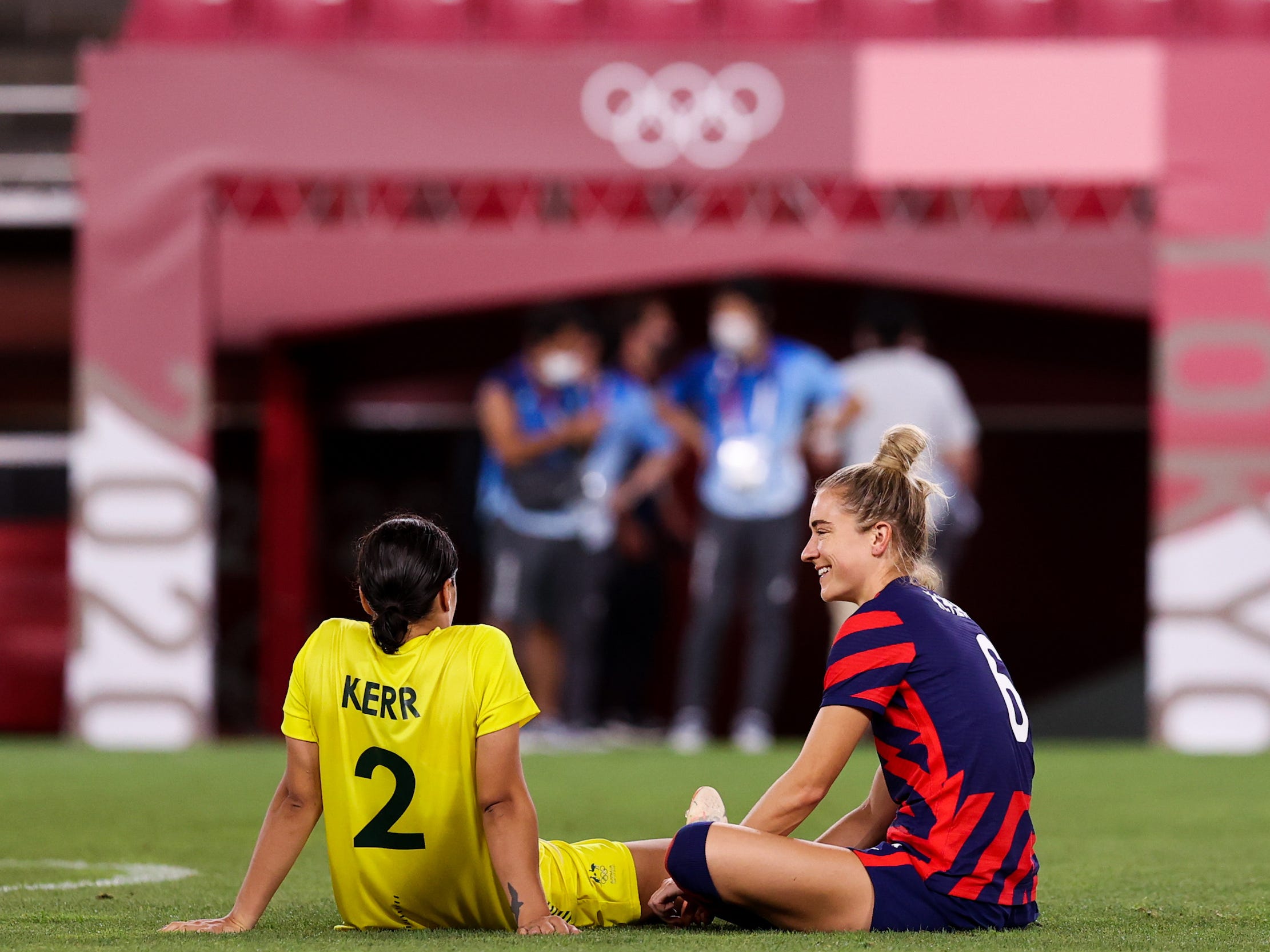 USWNT's Kristie Mewis comforts Aussie star Sam Kerr.