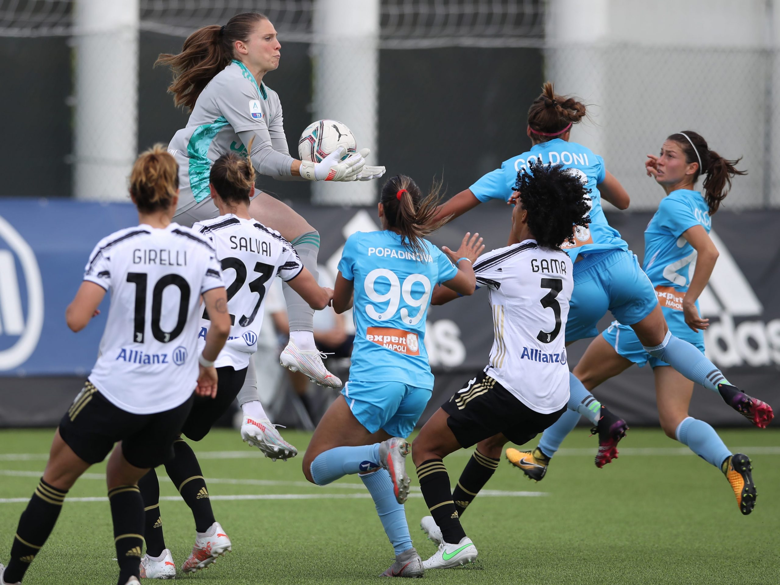 Members of Juventus FC's women's team in black and white uniforms face off in a Women Serie A match in May 2021.