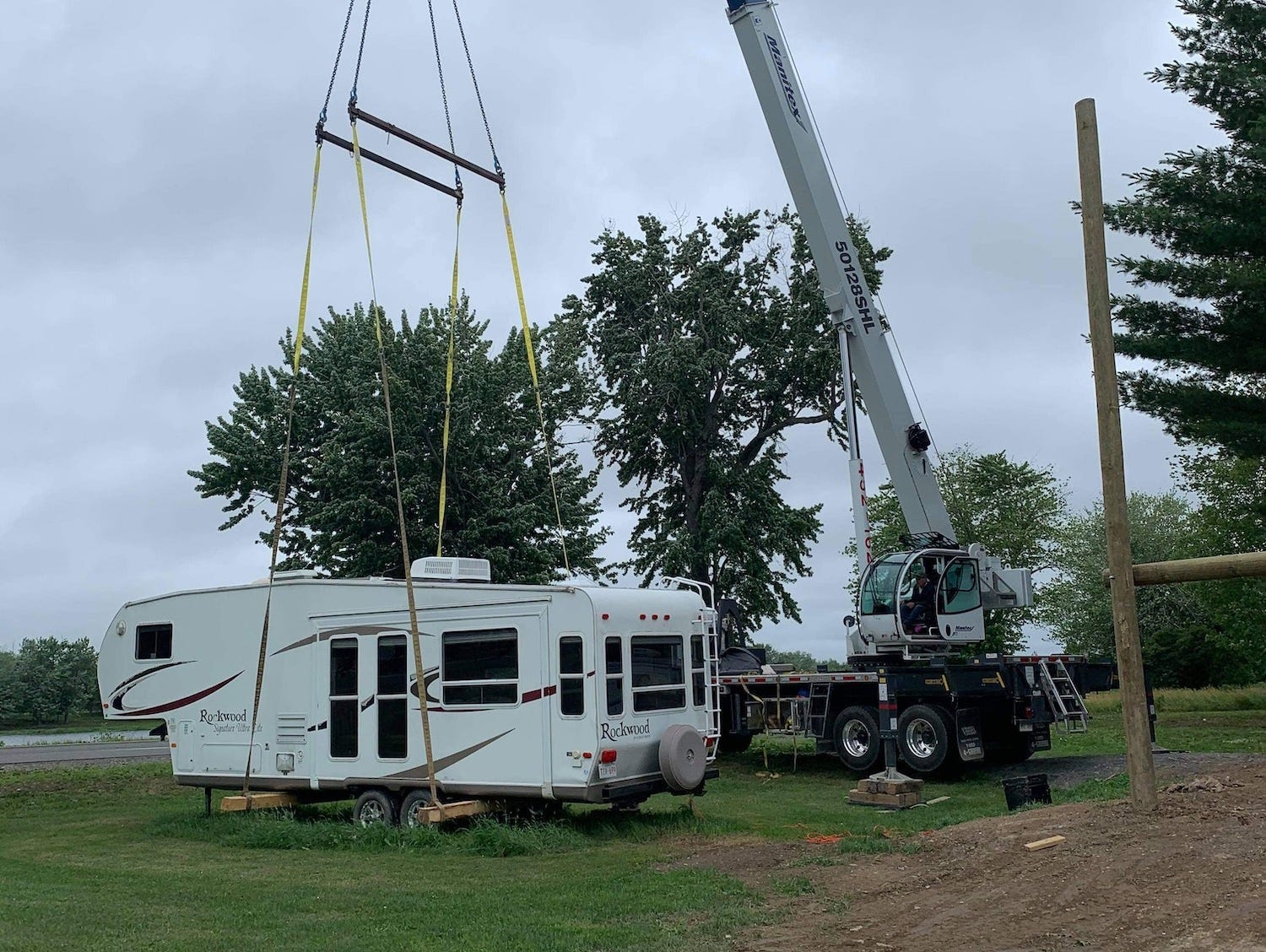 Images of a RV lofted on a platform in New Brunswick, Canada.