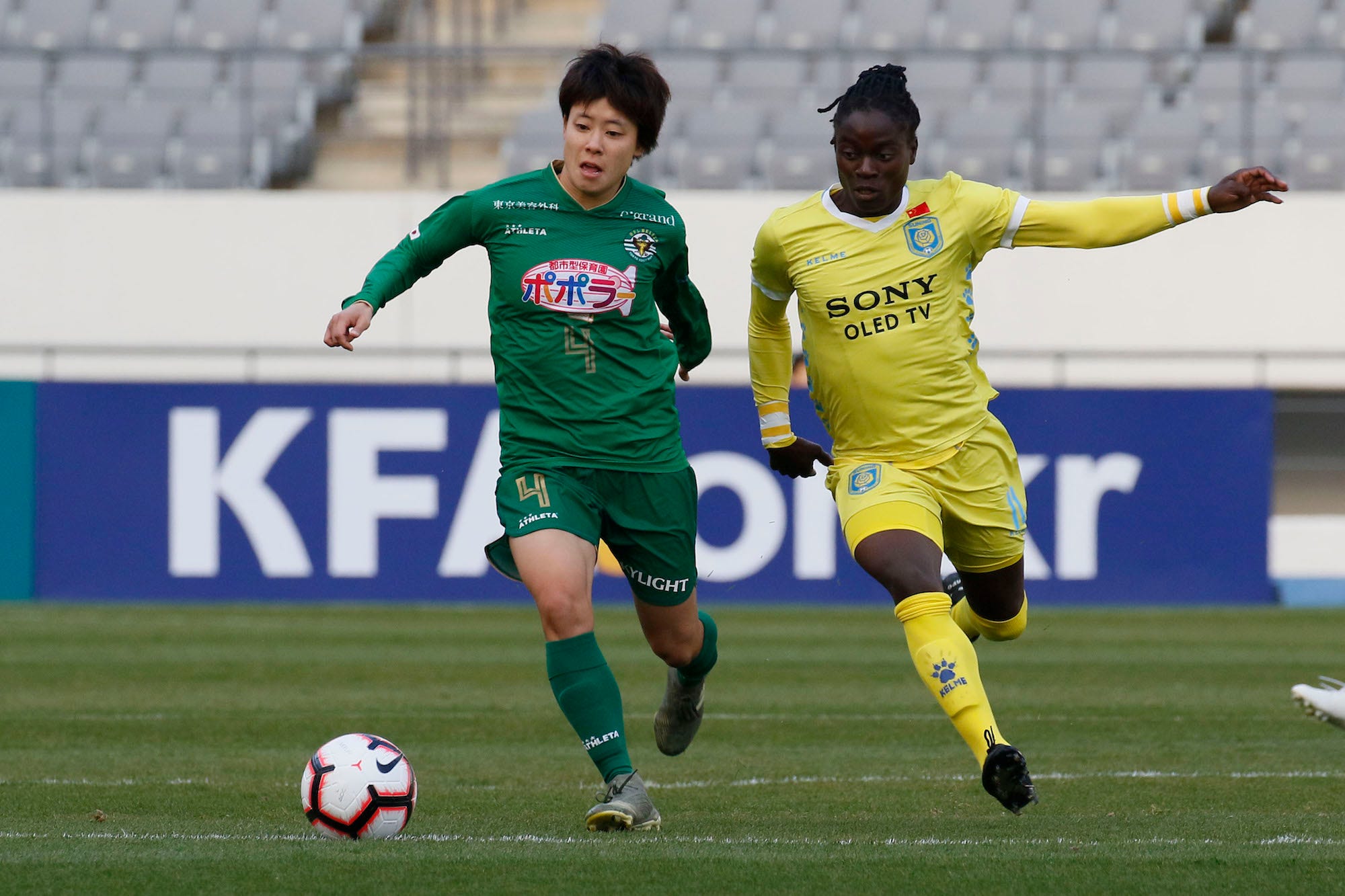 Mayo Doko of Nippon TV Beleza and Tabitha Chawinga of Jiangsu Suning Ladies Football Club action during an Women's Club Championship