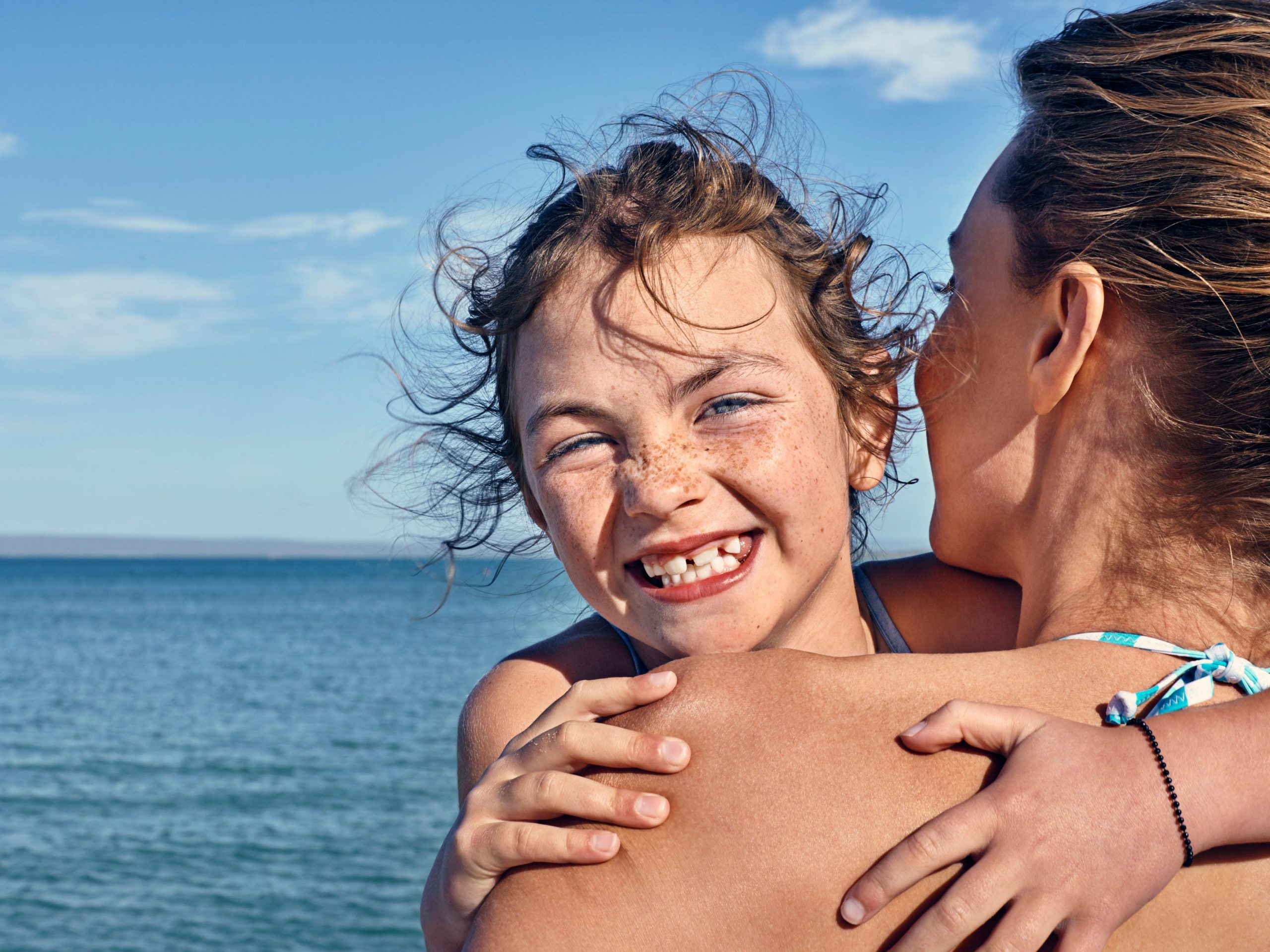Girl on the beach smiling