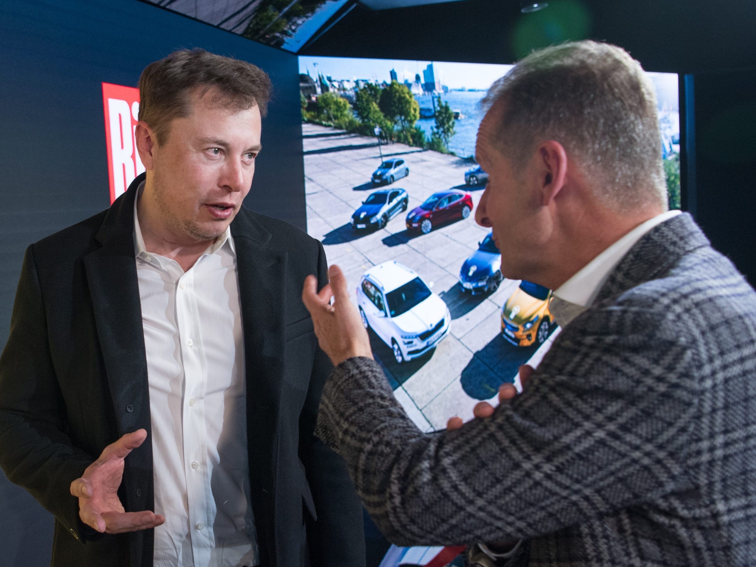 Tesla's Elon Musk and VW's Herbert Diess