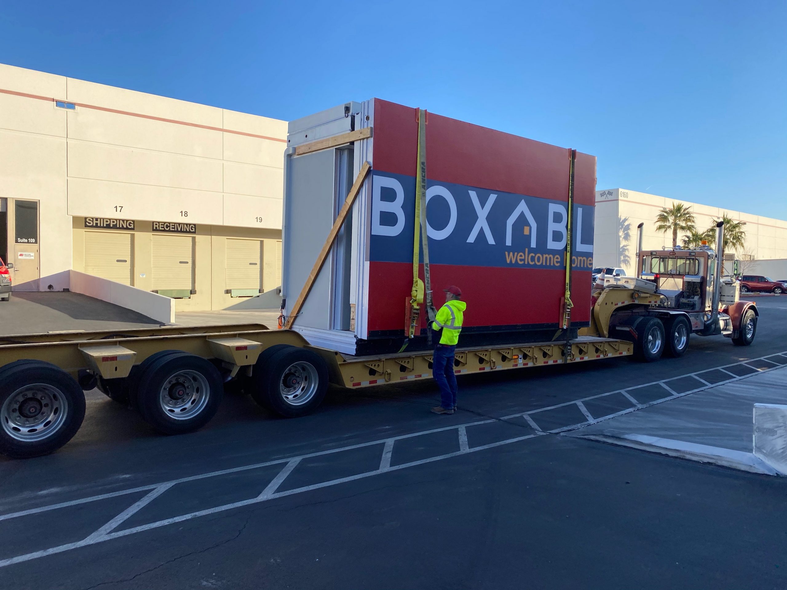 the Boxabl logo on a unit being moved