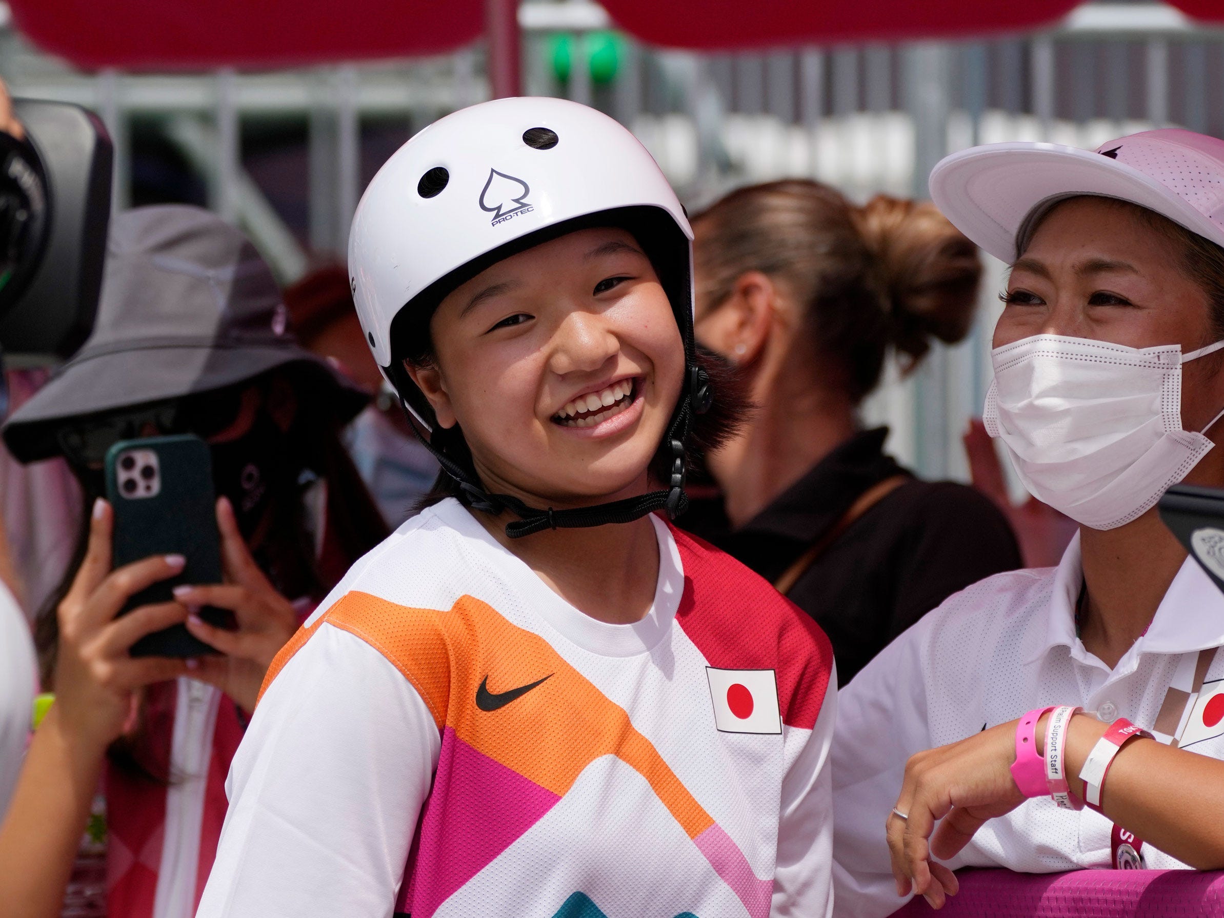 Japan's Momiji Nishiya smiles after winning gold at Tokyo 2020.