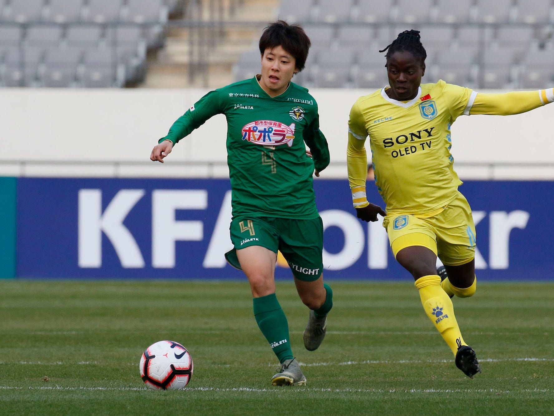 Mayo Doko of Nippon TV Beleza and Tabitha Chawinga of Jiangsu Suning Ladies Football Club action during an Women's Club Championship