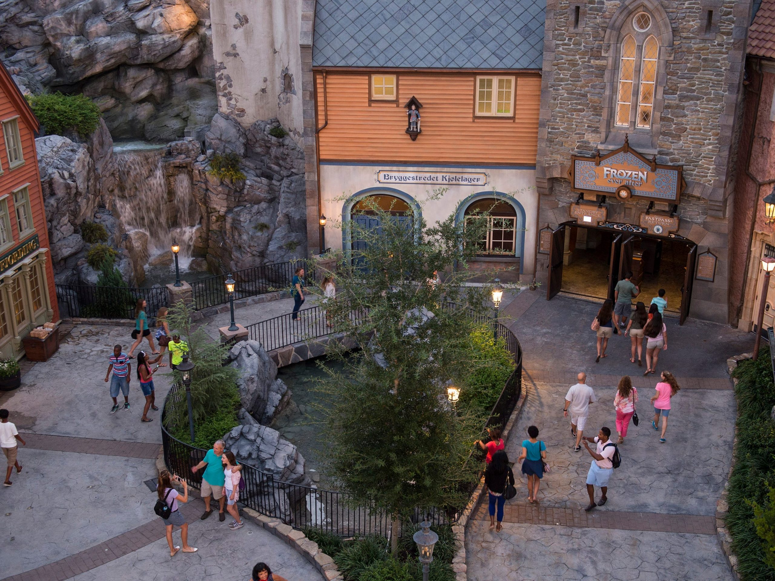An ariel shot of Epcot's Norway shows buildings, trees, and people walking around.