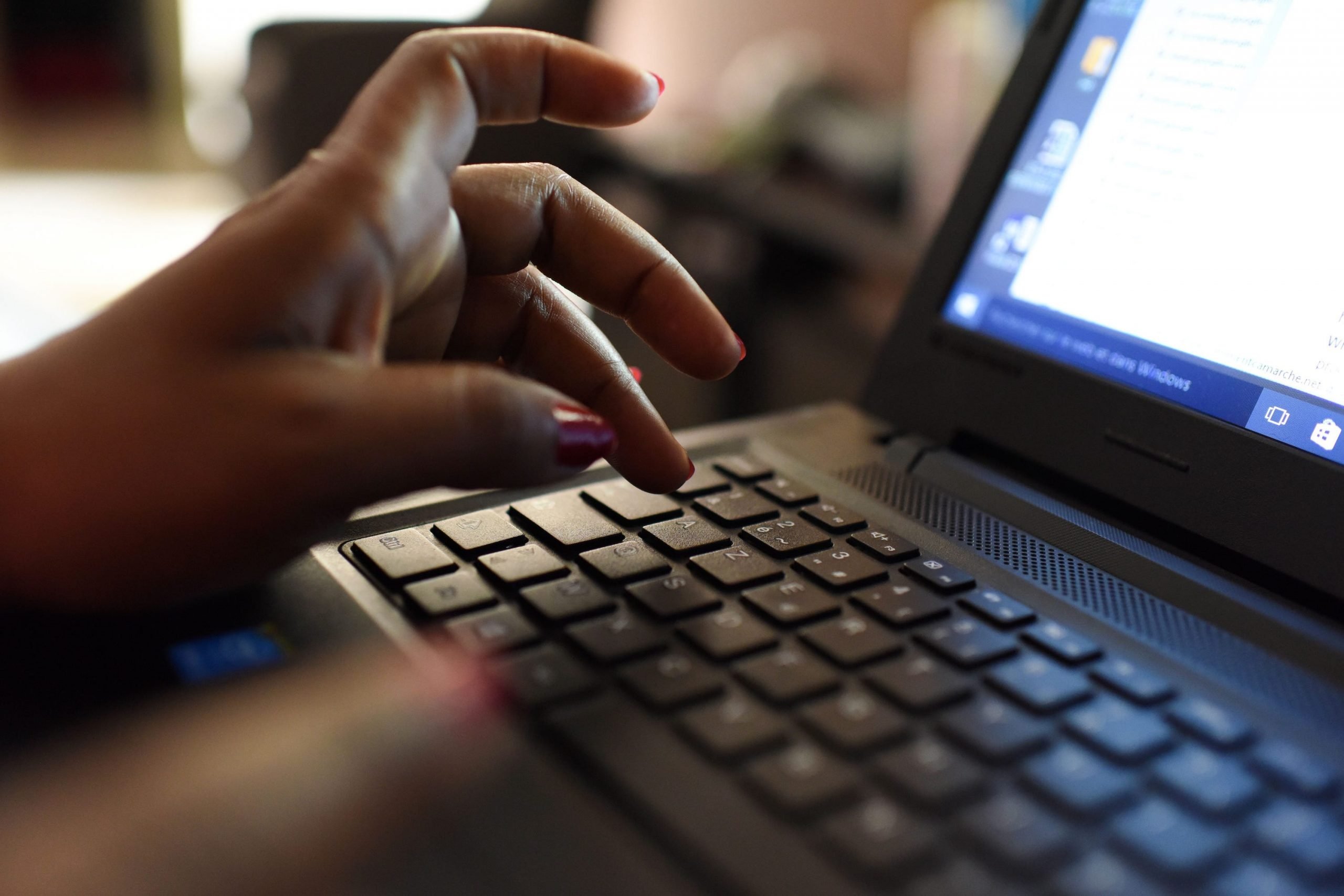 woman uses laptop