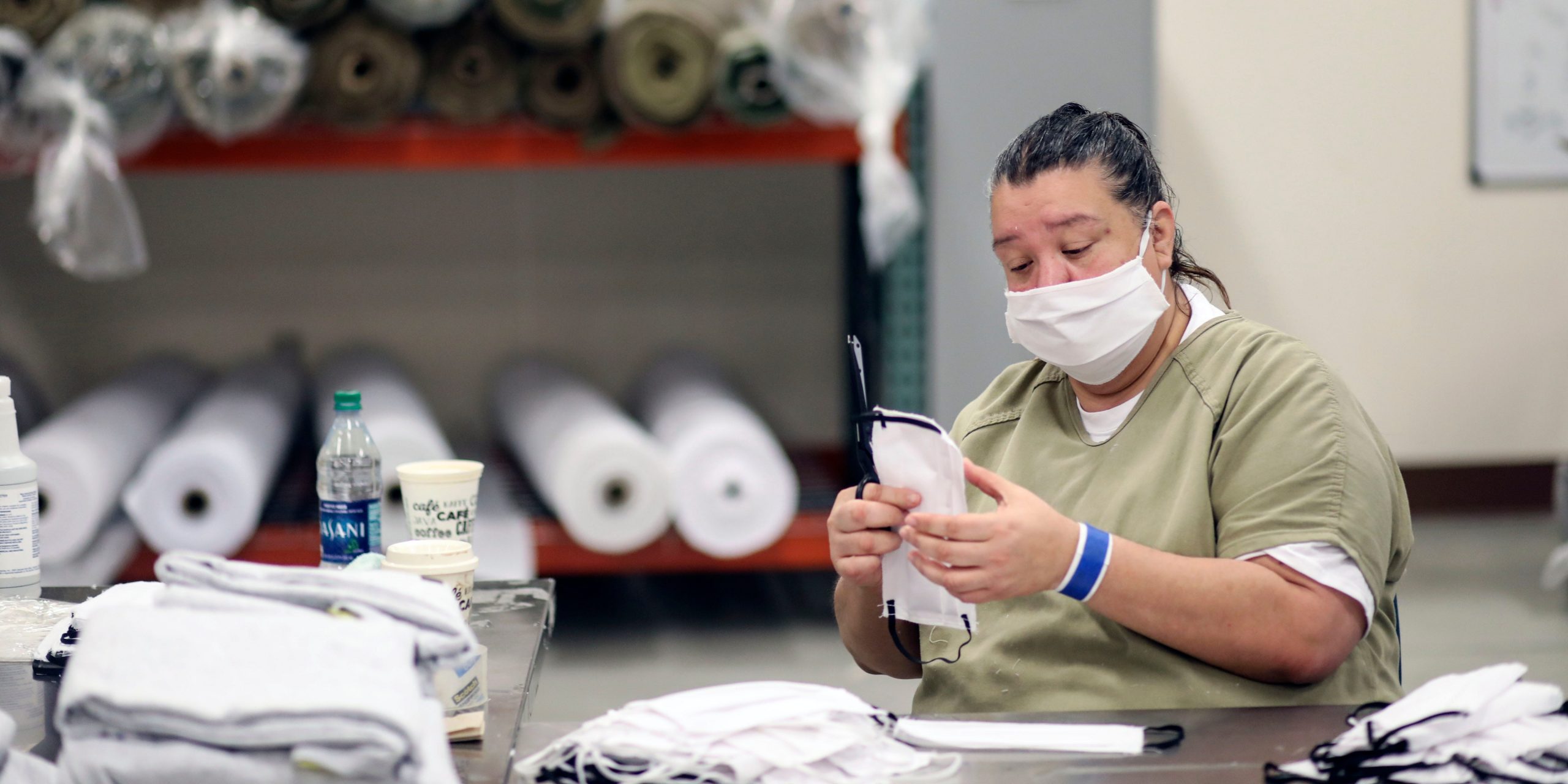 A prisoner is making COVID-19 face masks.