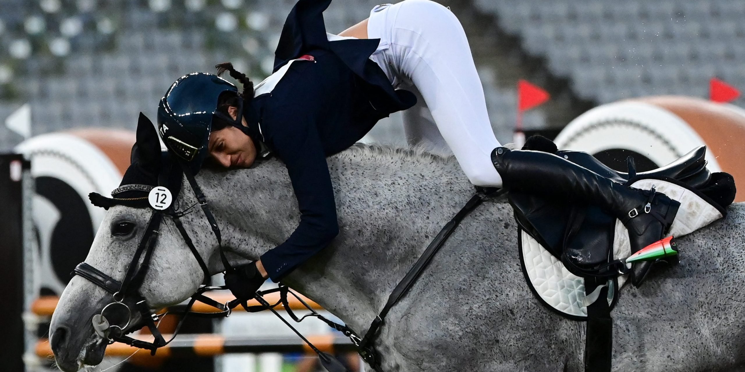 Elena Micheli of Italy is bucked from her horse during the showjumping portion of the Olympic modern pentathlon