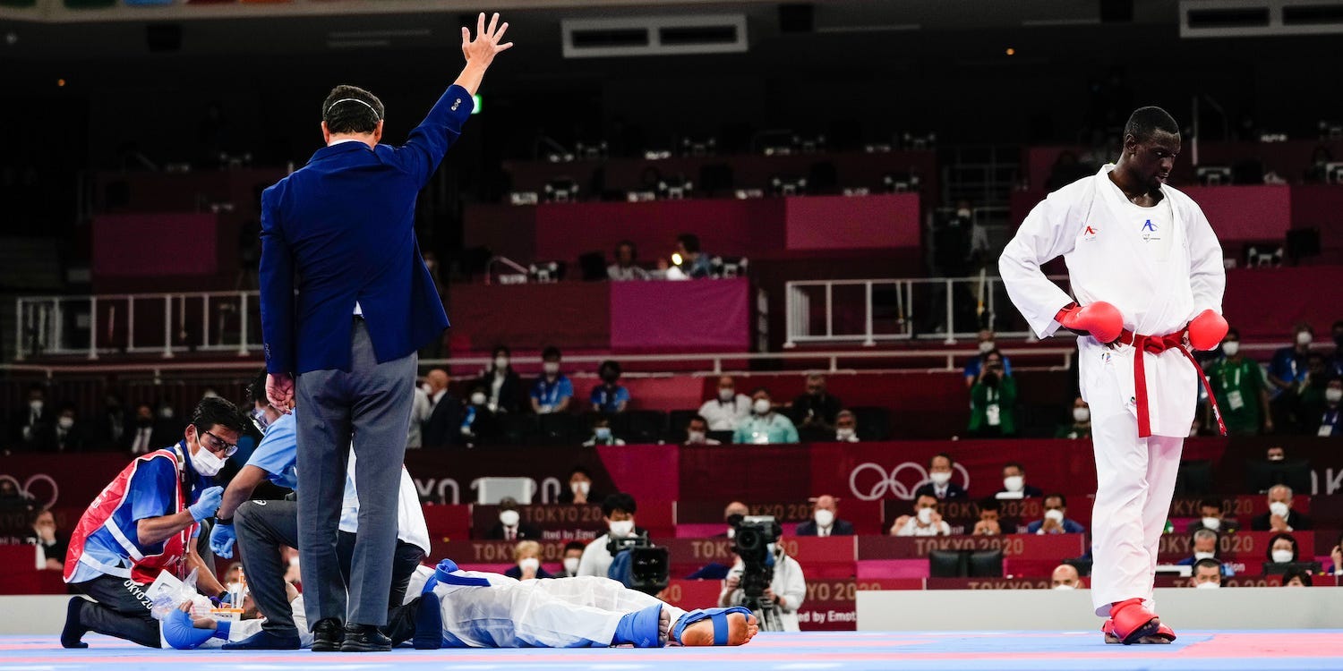 Tareg Hamedi looks dejected as Sajad Ganjzadeh, who was unconscious, went on to win the gold medal by way of disqualification.