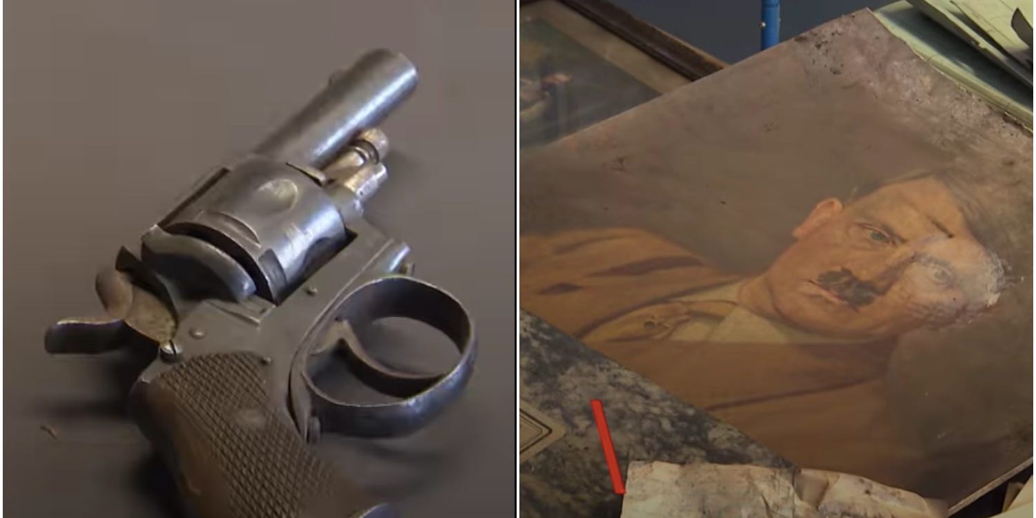 revolver and portrait of Hitler