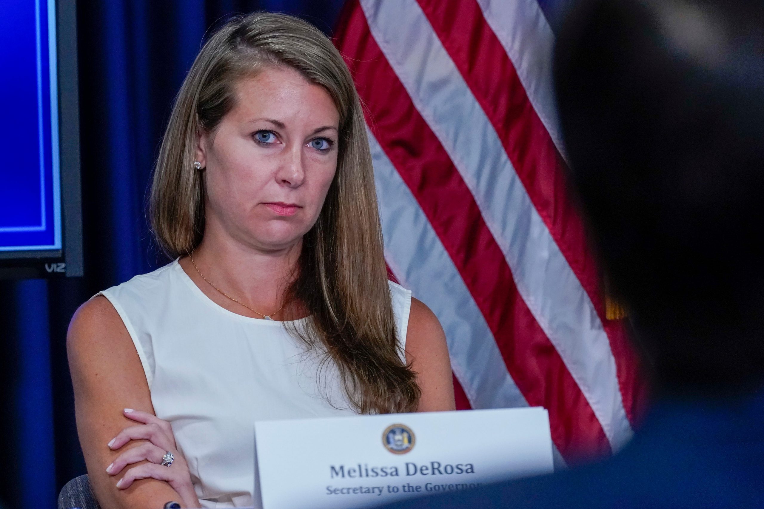 Secretary to the Governor Melissa DeRosa listens as New York Gov. Andrew Cuomo speaks to reporters during a news conference, Wednesday, June 23, 2021, in New York.