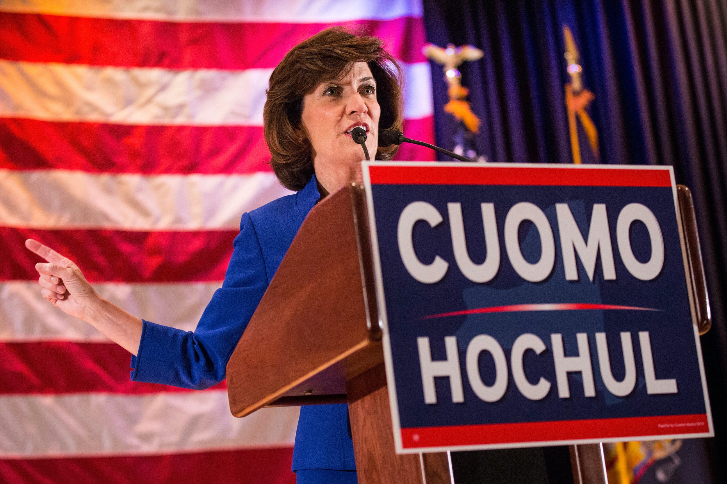 New York Lt. Gov Kathy Hochul campaigns behind a "CUOMO-HOCHUL" sign in the 2014 governor's race.