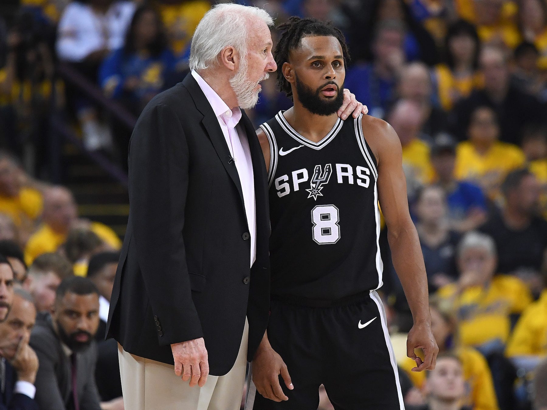 Gregg Popovich speaks to Patty Mills during the 2018 NBA Playoffs.