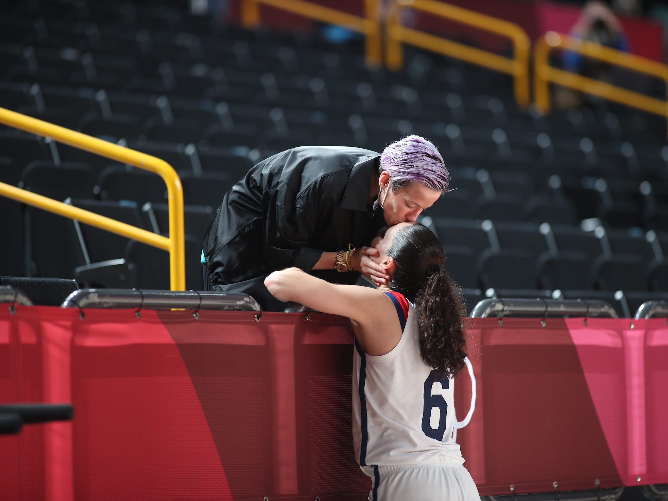Megan Rapinoe kisses fiancée Sue Bird.