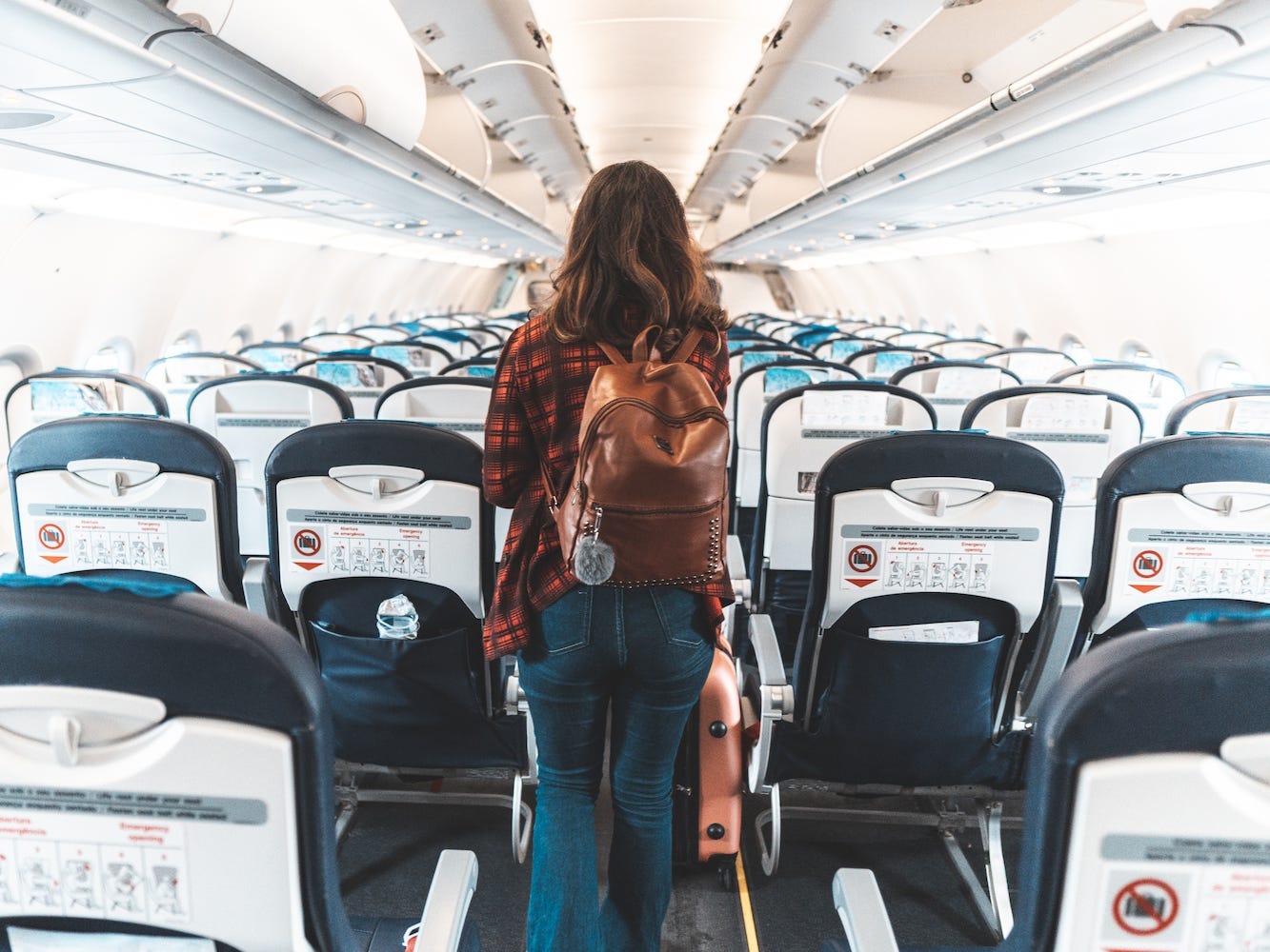 A person boards an airplane.