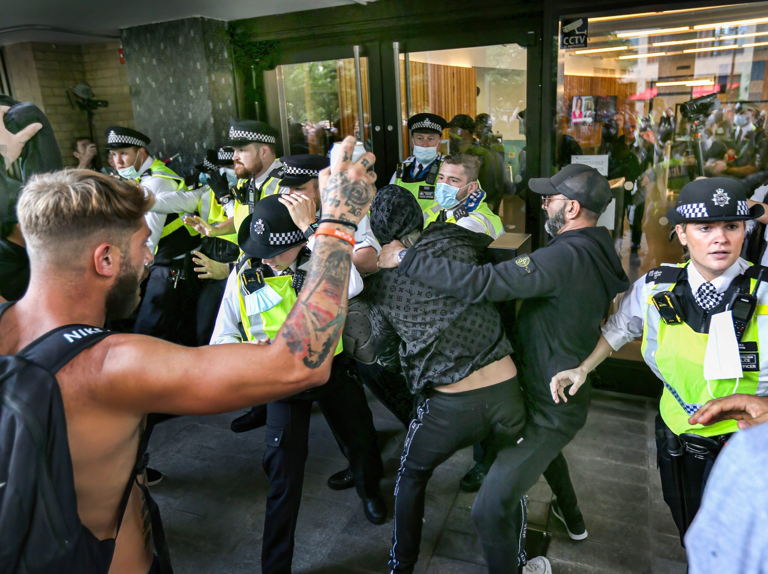 Police officers stop protesters from accessing Studioworks during the demonstration. Protesters held a demonstration against the mainstream media bias, covid restrictions, vaccine passports, COVID vaccination for children and the loss of freedom under the Coronavirus Act.