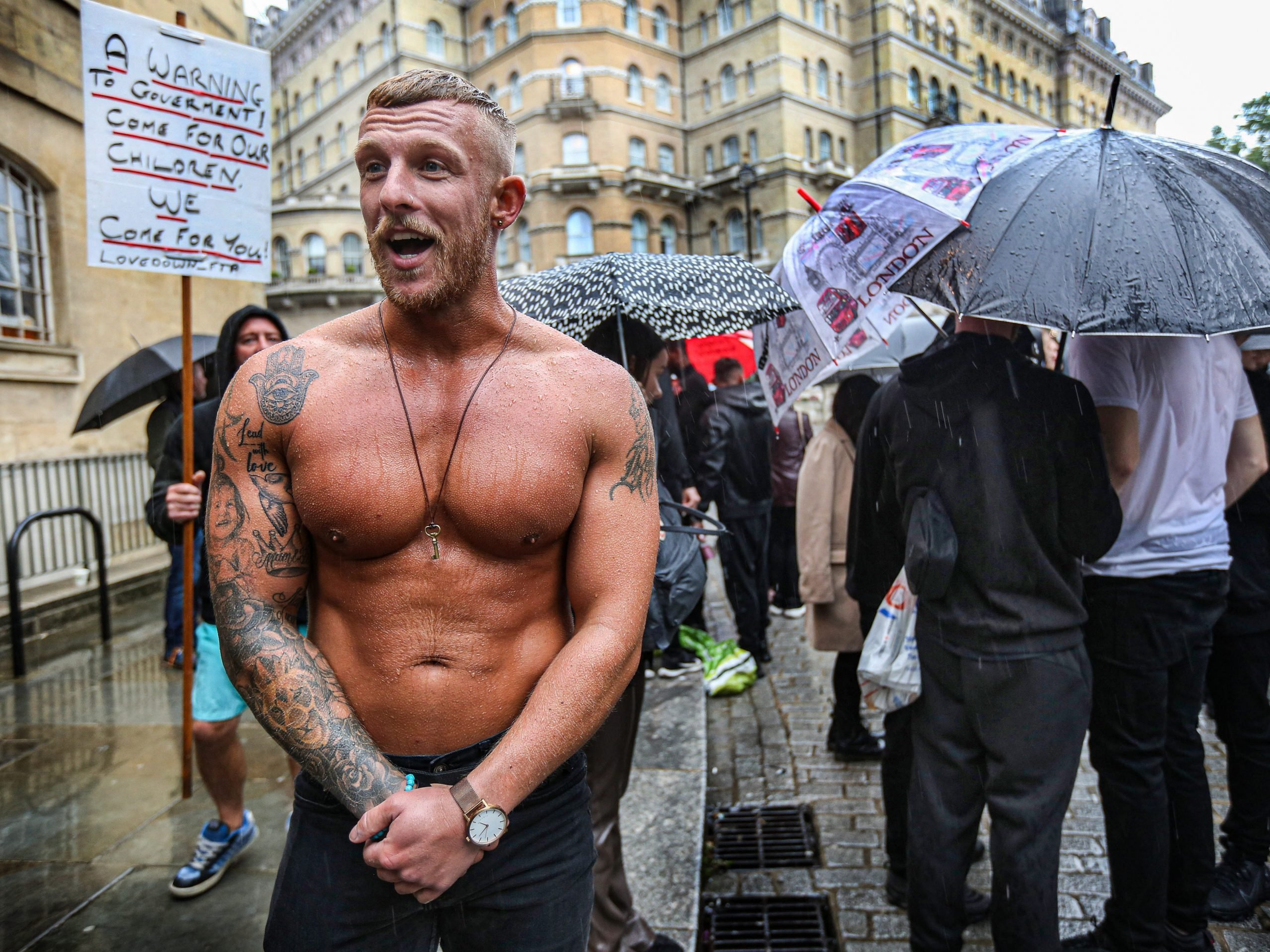 A topless protester chants slogans outside the BBC building during the demonstration. Protesters held a demonstration against the mainstream media bias, covid restrictions, vaccine passports, Covid vaccination for children and the loss of freedom under the Coronavirus Act.