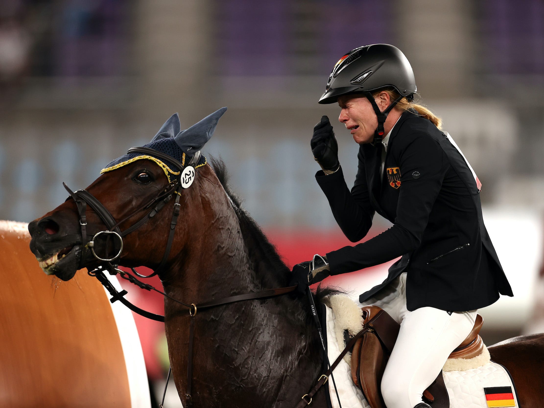 Annika Schleu of Team Germany looks dejected following her run in the Riding Show Jumping of the Women's Modern Pentathlon.