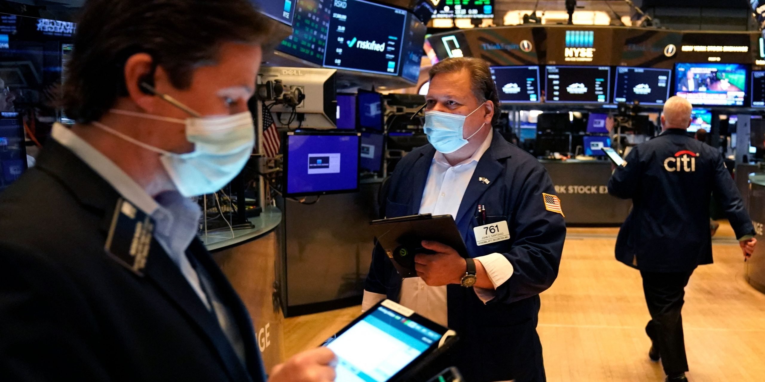 Traders work on the floor at the New York Stock Exchange in New York, on July 29, 2021.