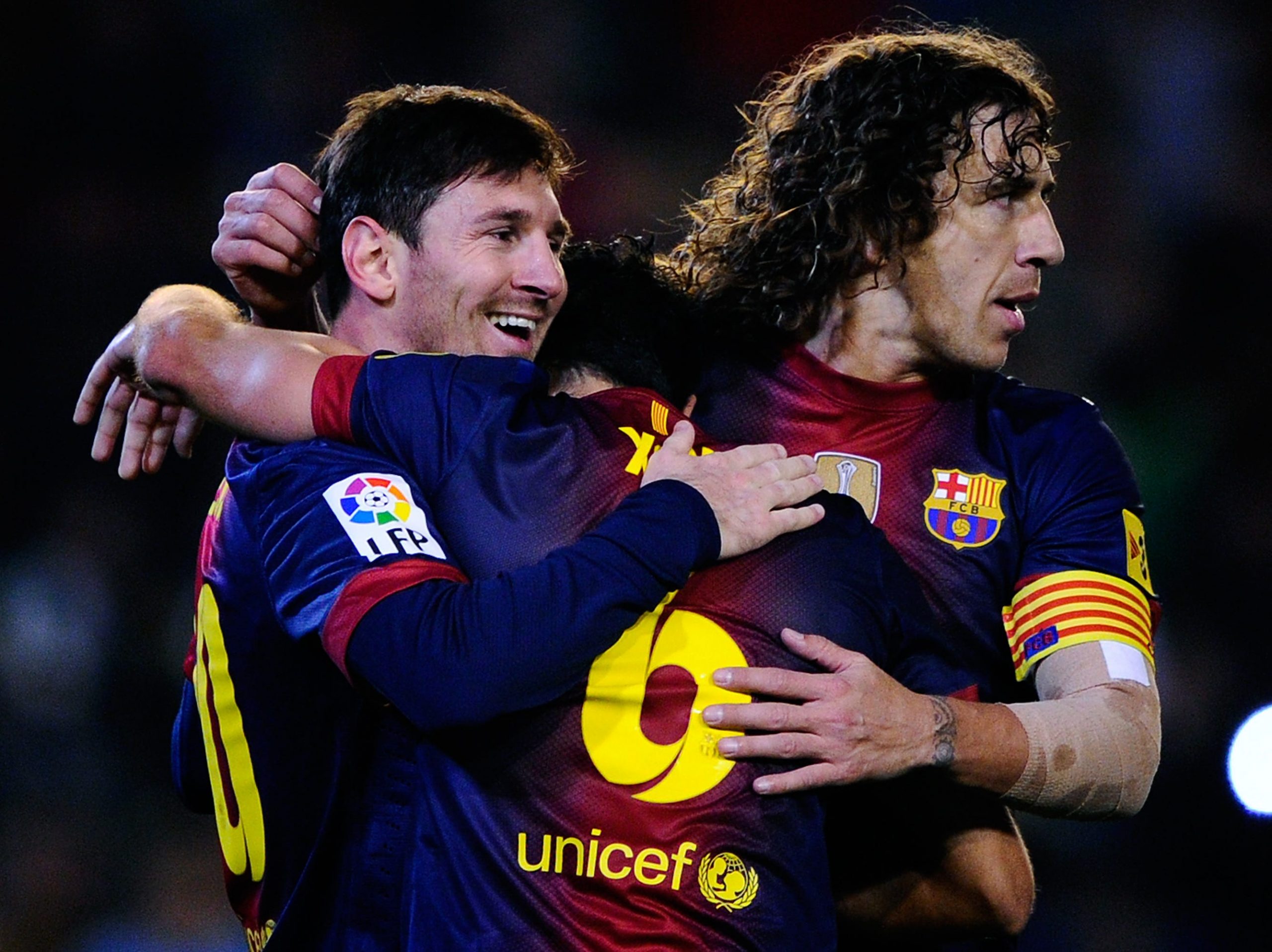 Lionel Messi, Xavi and Carles Puyol