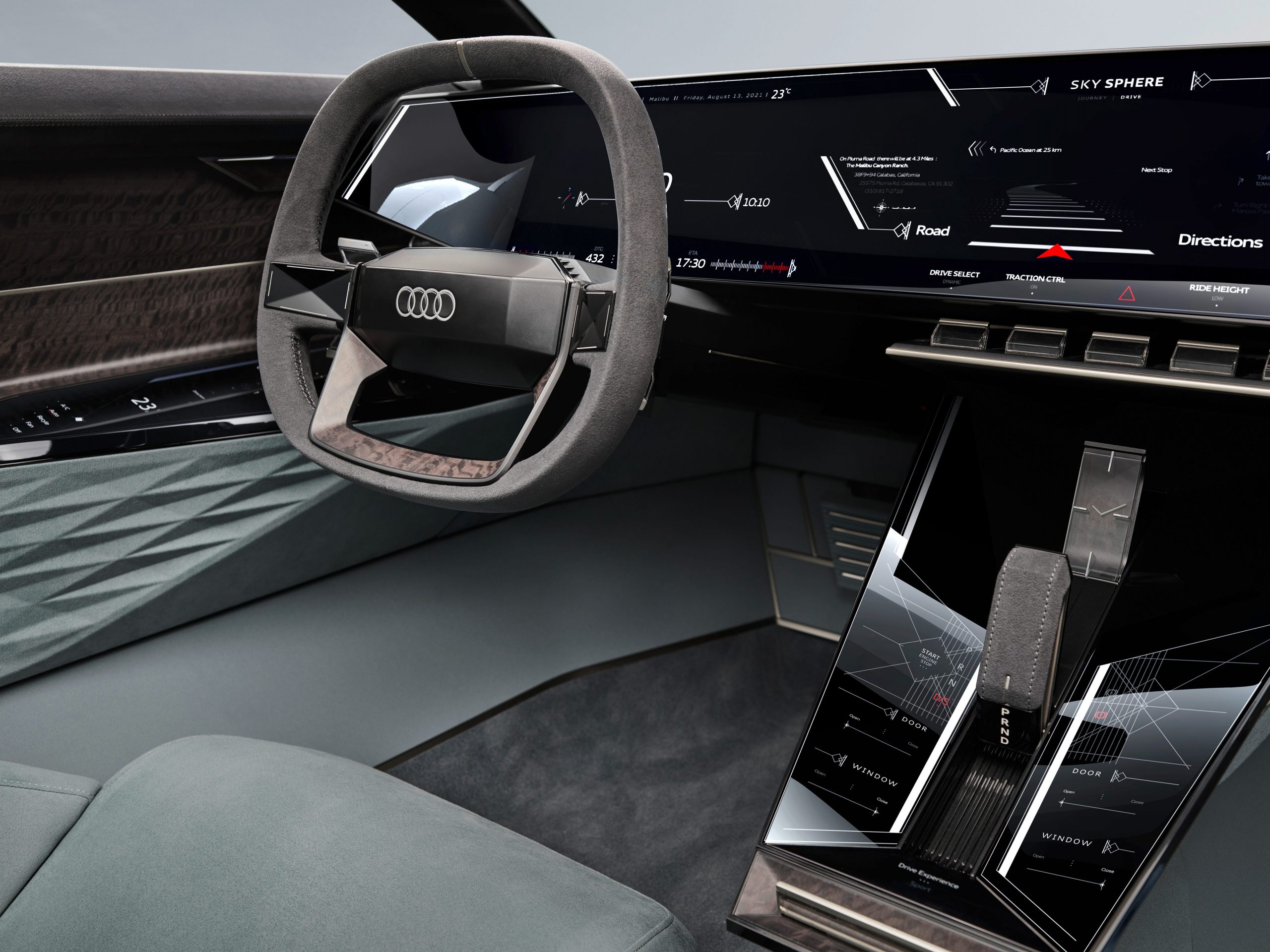 The grey interior of Audi's new Skysphere concept with a steering wheel that is slightly square shaped.