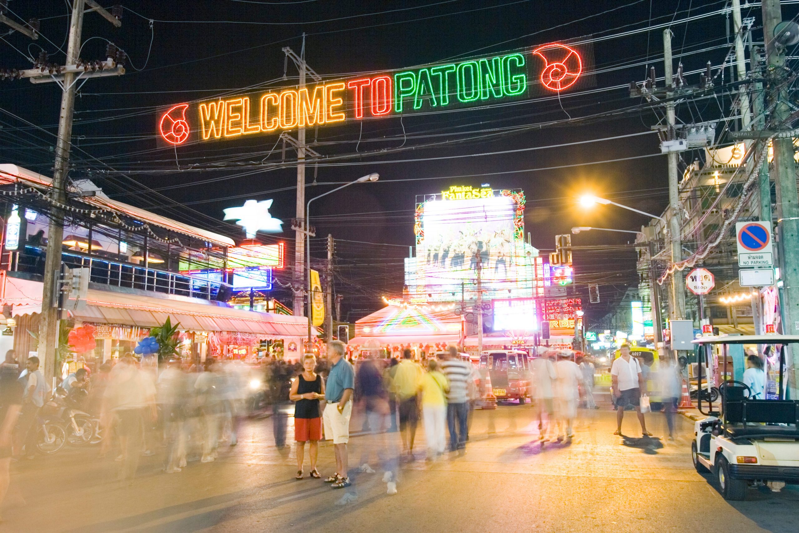 Blurred photo of crowd outdoors at nighttime on Patong Beach, Phuket