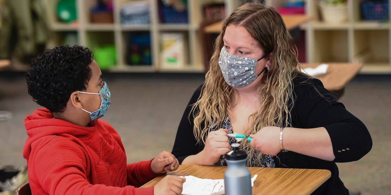 Learning Support teacher Sabrina Werley works with 4th grade student Jeremiah Ruiz at Cumru Elementary School in Cumru township Wednesday morning April 14, 2021.