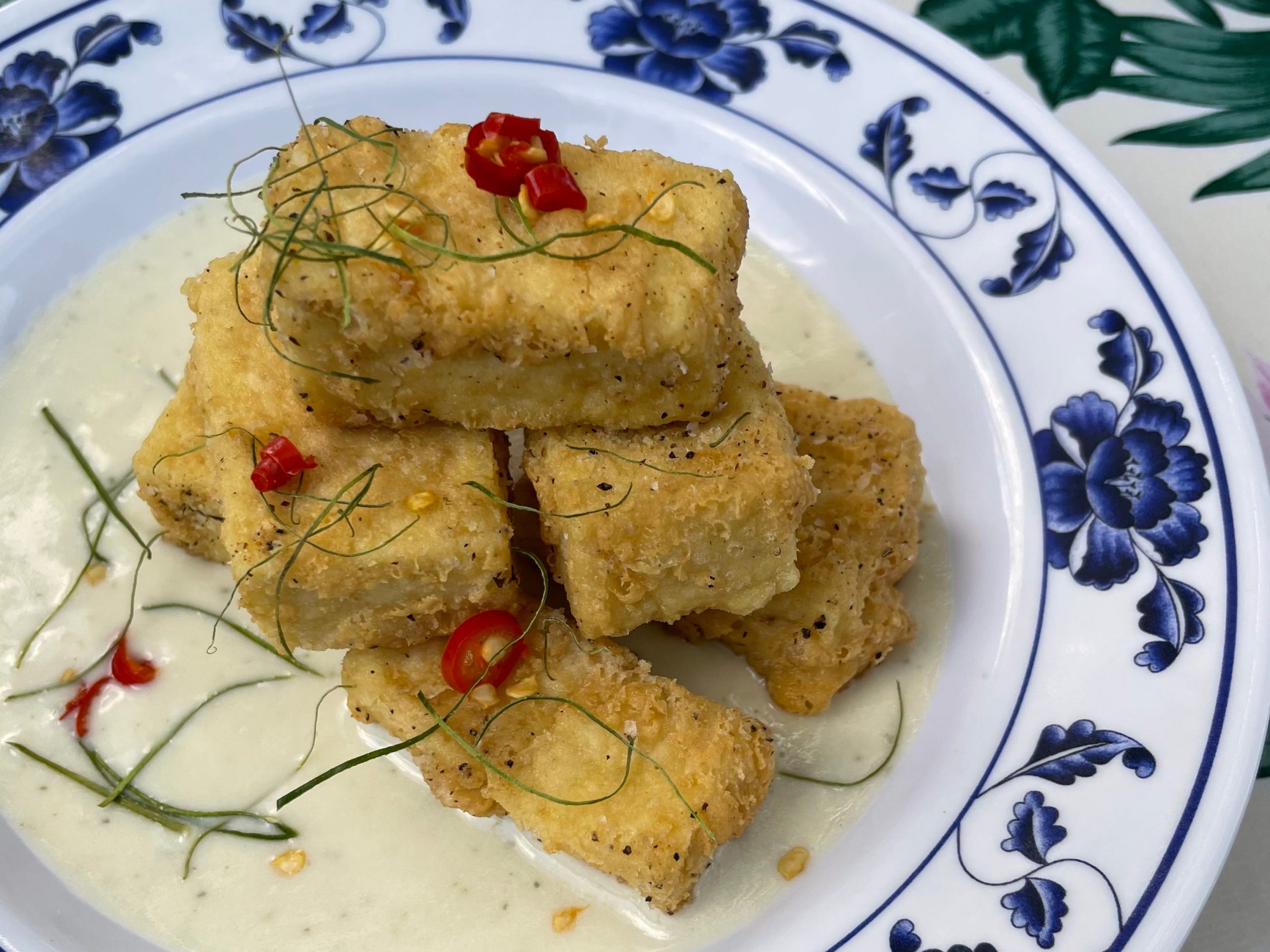 Salt and pepper tofu on a blue and white plate from Hai Hai in Minneapolis