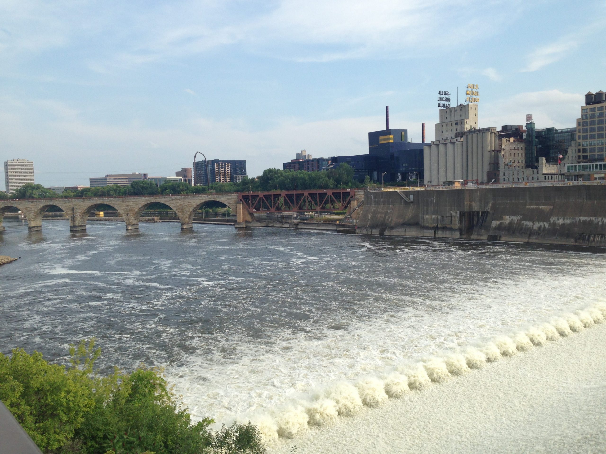 Stone Arch Bridge, water, and skyline in Minneapolis