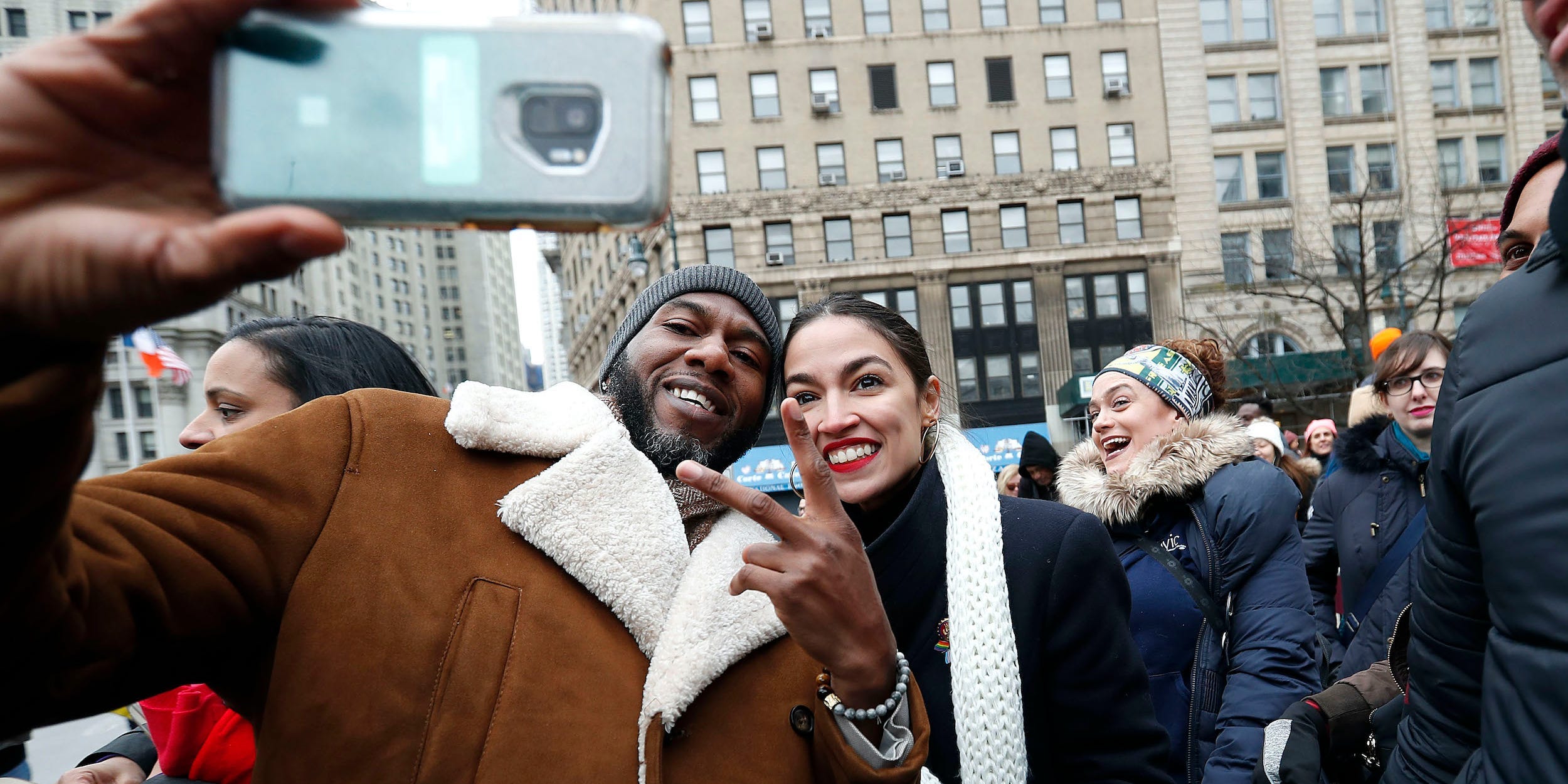 Jumaane Williams and AOC pose for a selfie.