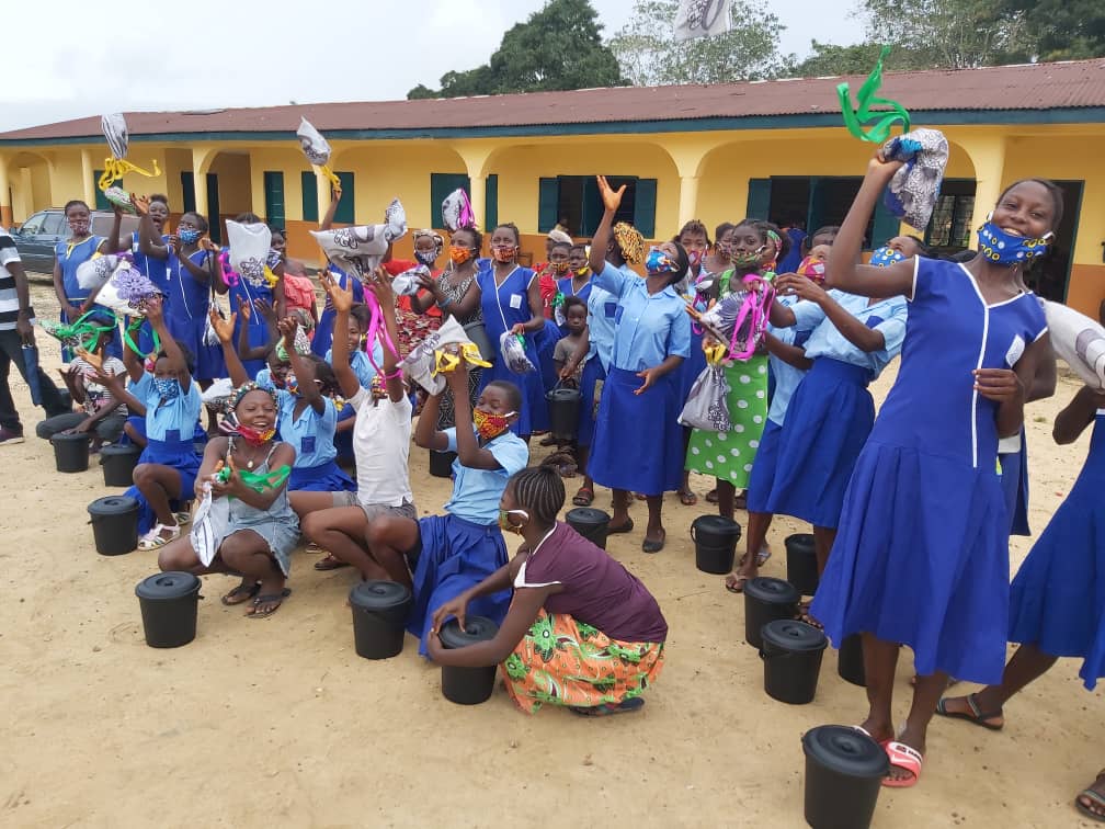 Girls in Bumpe, Sierra Leone, celebrate receiving sanitary pads from Princess Sarah Culberson's organization, Sierra Leone Rising.