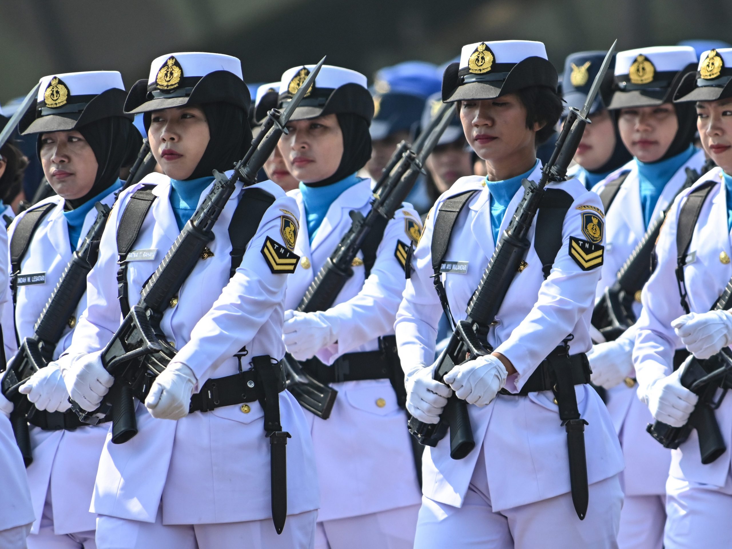 Female troops parade during a ceremony marking the 74th anniversary of the Indonesian military at Halim air force base in Jakarta on October 5, 2019.