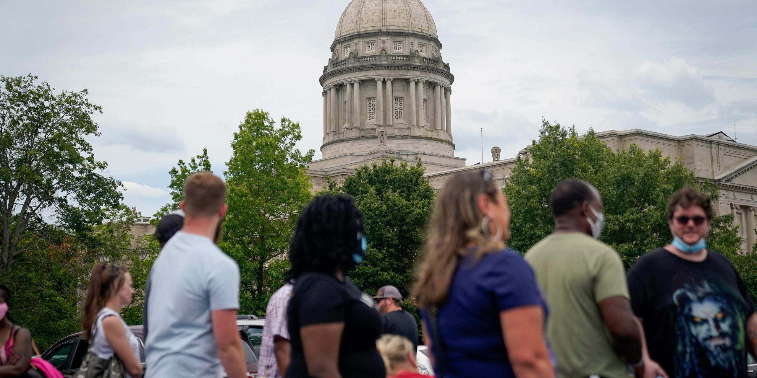 People line up outside a temporary unemployment office established by the Kentucky Labor Cabinet at the State Capitol Annex in Frankfort, Kentucky, U.S. June 17, 2020. REUTERS/Bryan Woolston