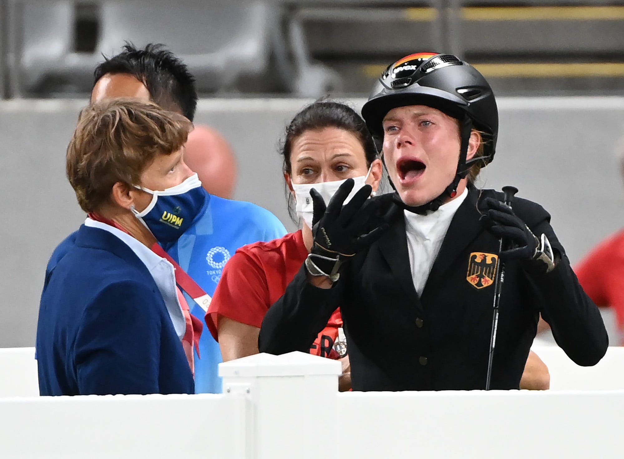 Annika Schleu (M) from Germany after her disqualification. Her horse had refused to jump several times.