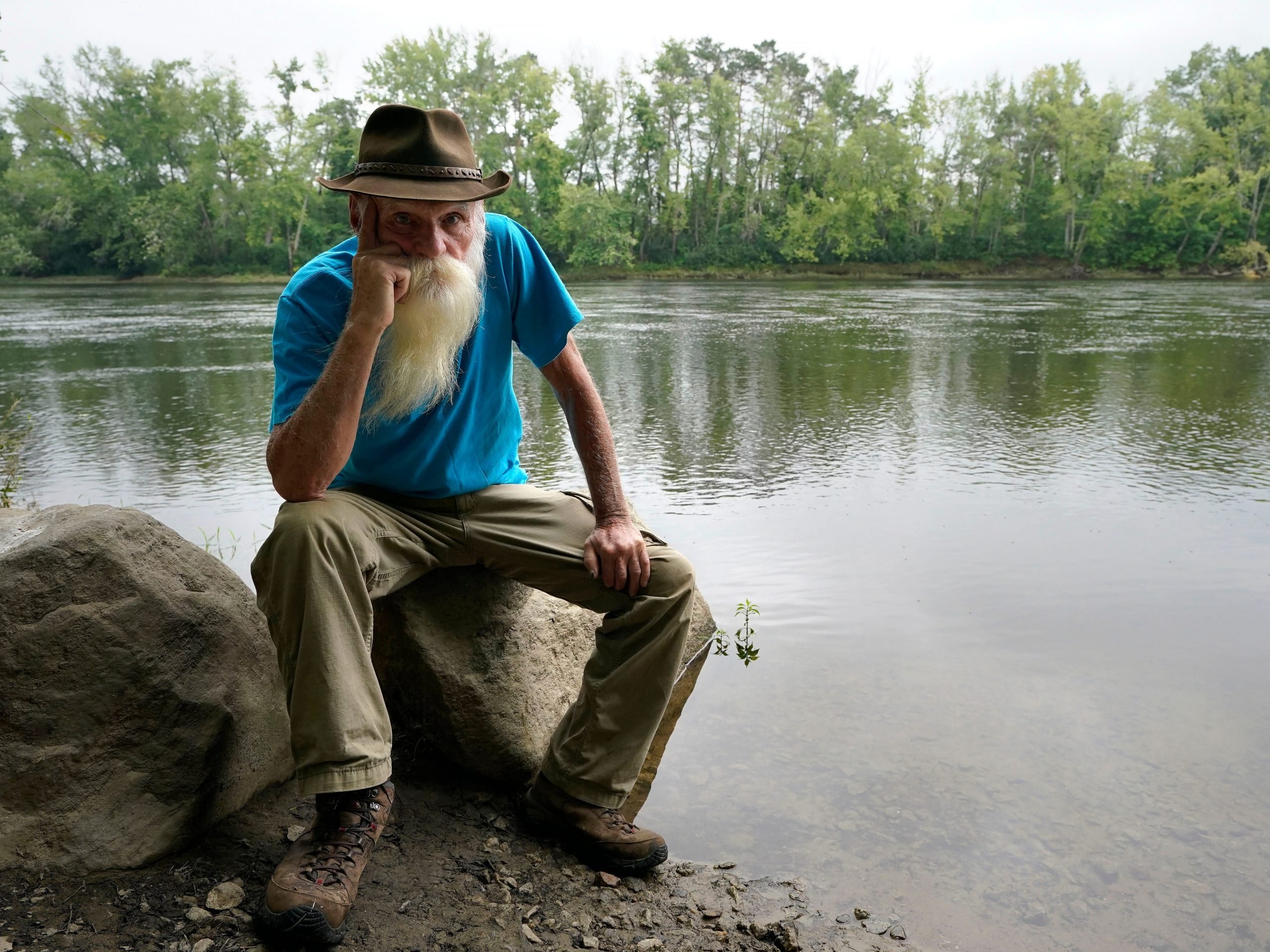 David Lidstone sits for a photograph near the Merrimack River, Tuesday, Aug. 10, 2021, in Boscawen, N.H.